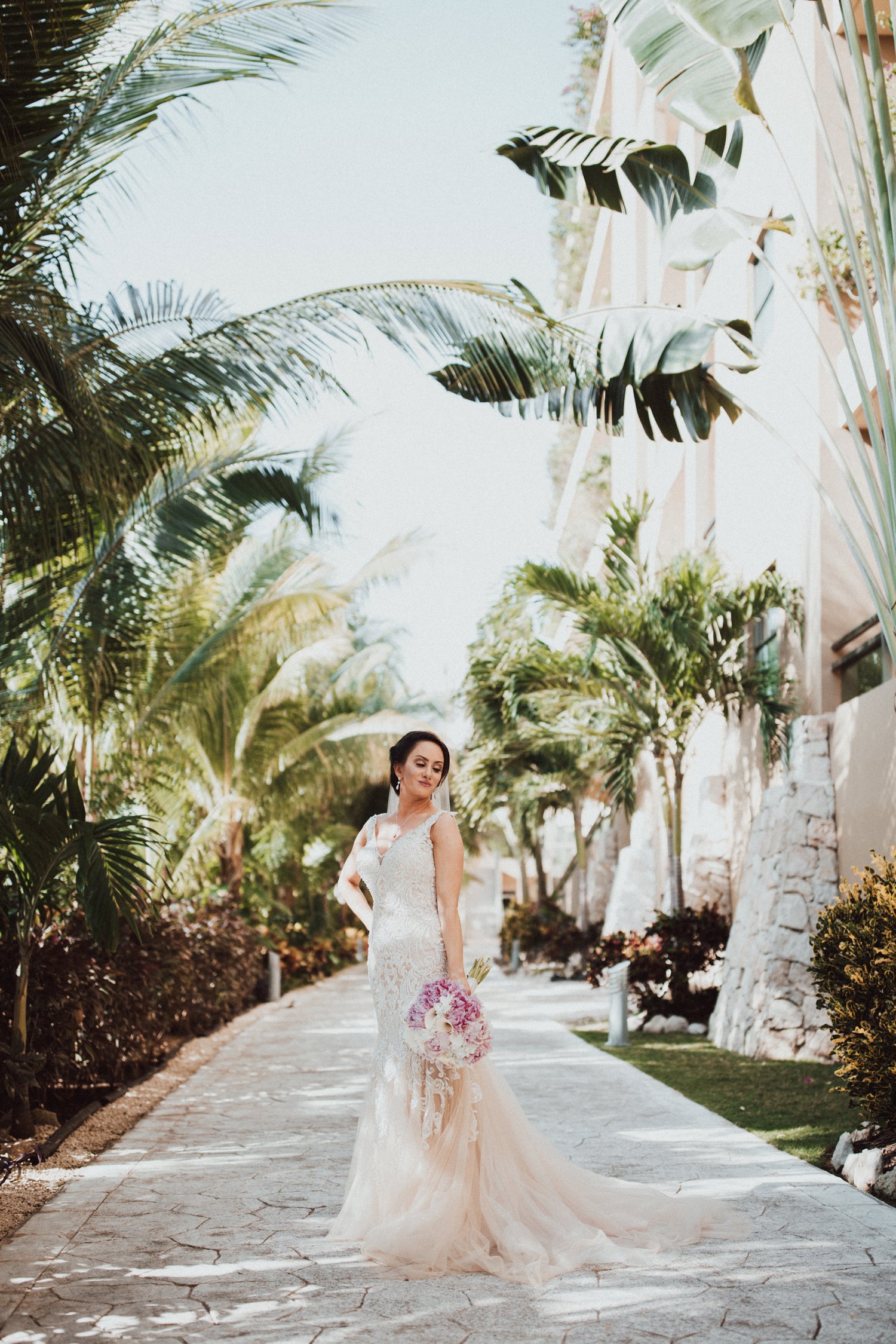  images by feliciathephotographer.com | destination wedding photographer | el dorado riviera maya | glamorous | beachside | resort | bride | beaded dress | pearl edged veil | pink and white bouquet | tropical | candid | allure | 
