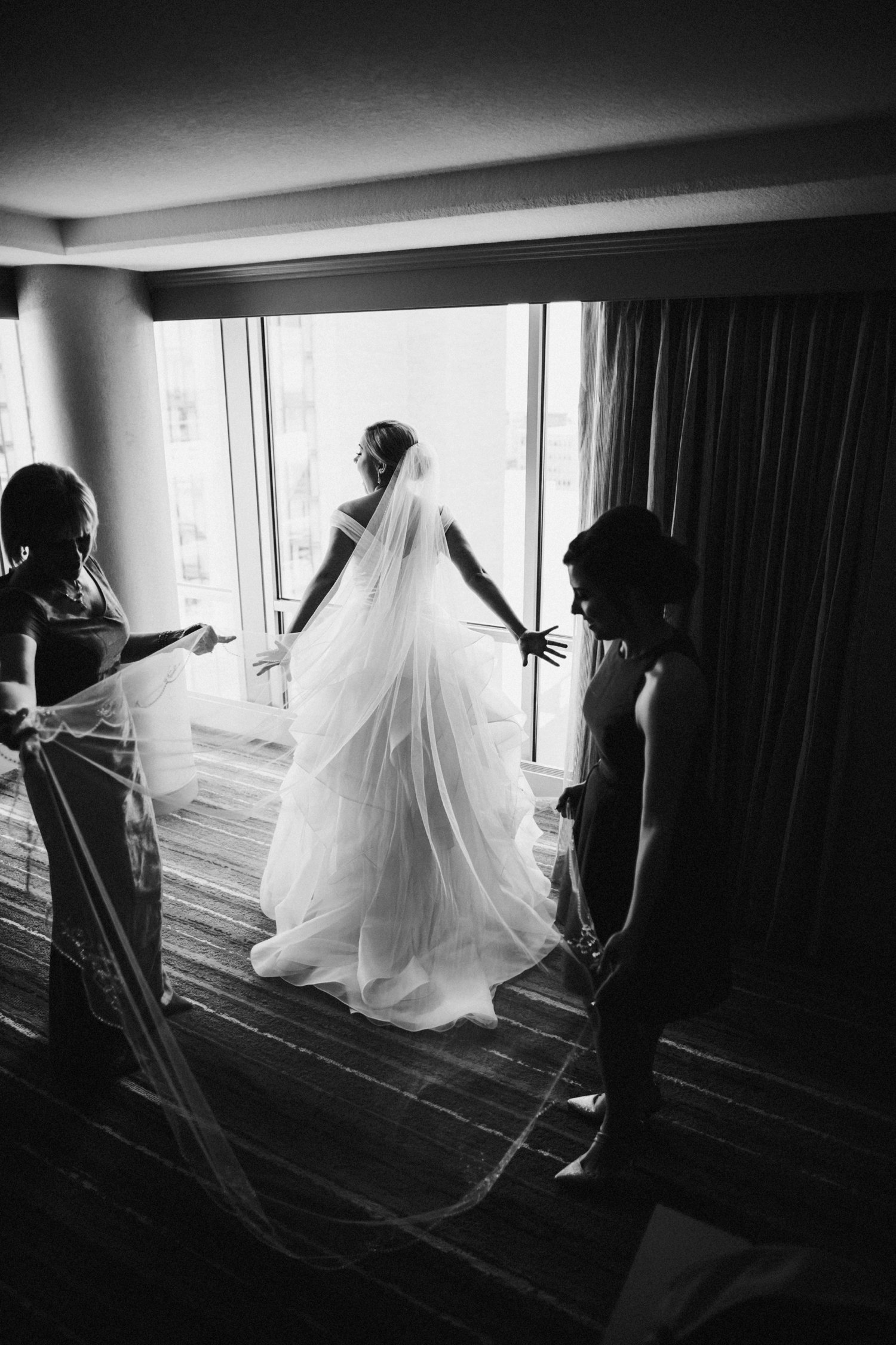  images by feliciathephotographer.com | destination wedding photographer | kansas city | summertime | classic | getting ready | details | mother of the bride | putting on the dress | the gown gallery | pink dress | fitted bodice | maggie sottero | black and white | 