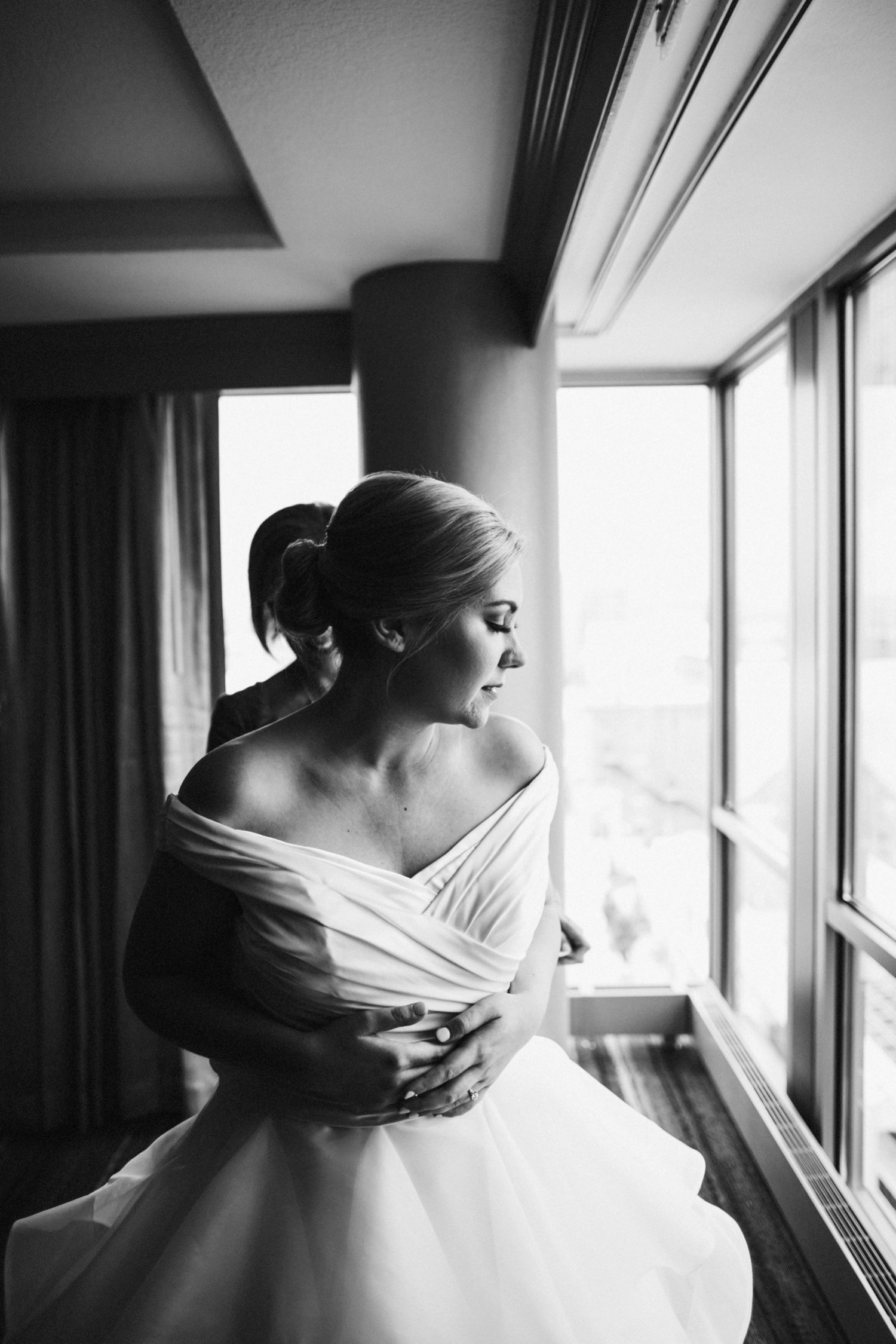  images by feliciathephotographer.com | destination wedding photographer | kansas city | summertime | classic | getting ready | details | black and white | off the shoulder | the gown gallery | putting on the dress | maggie sottero | updo | posh kc | 