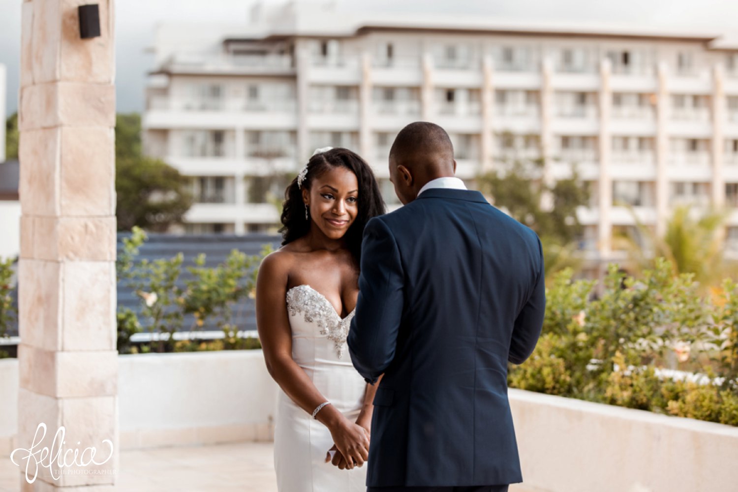  images by feliciathephotographer.com | destination wedding photographer | st lucia | l&s travel | the Royalton | ceremony | exchanging vows | bride and groom | fitting beaded dress | kleinfeld | navy suit | tropical | romantic | 
