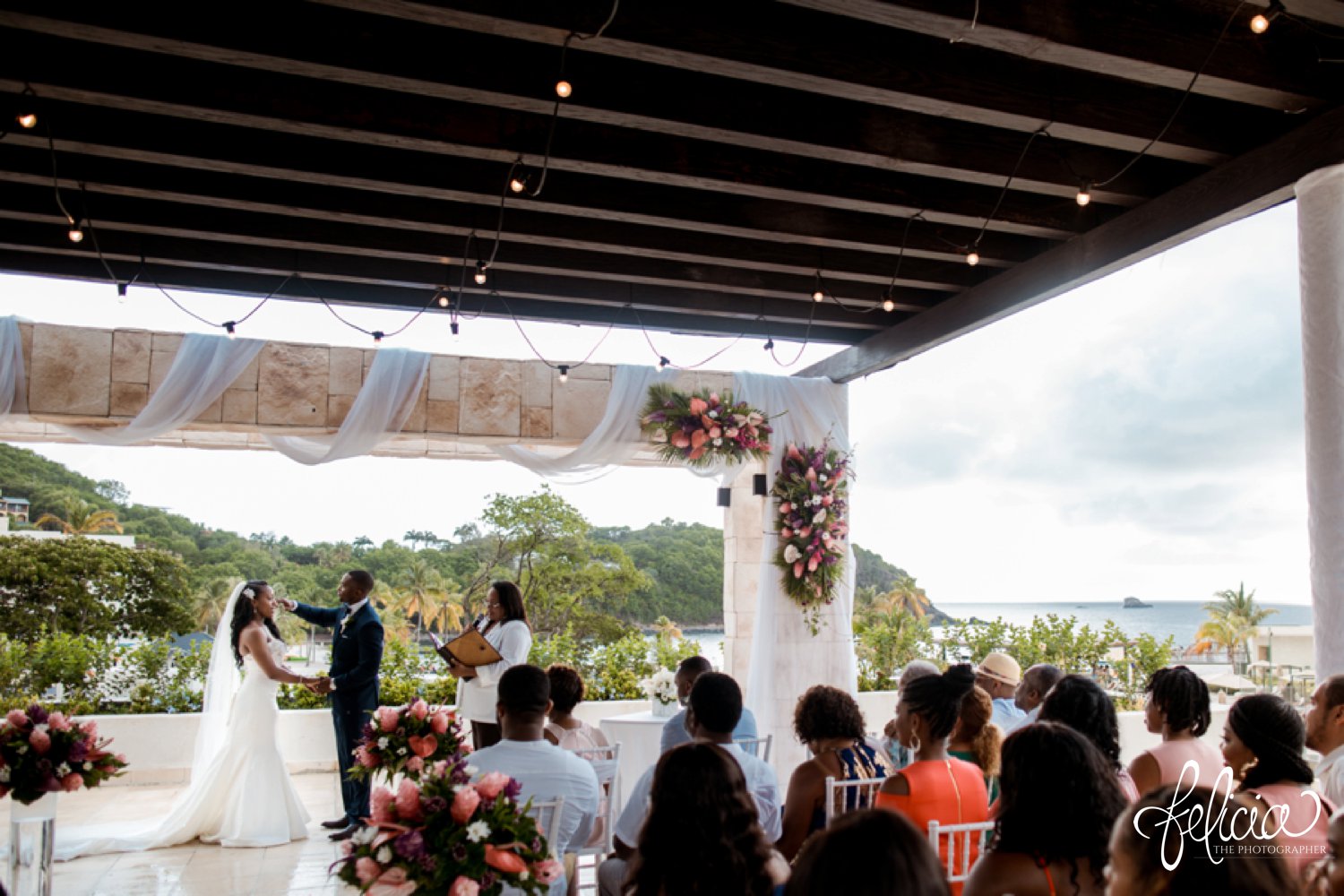  images by feliciathephotographer.com | destination wedding photographer | st lucia | l&s travel | the Royalton | ceremony | exchanging vows | topical | Caribbean | wooden cabana | stone walkway | pink flowers | 