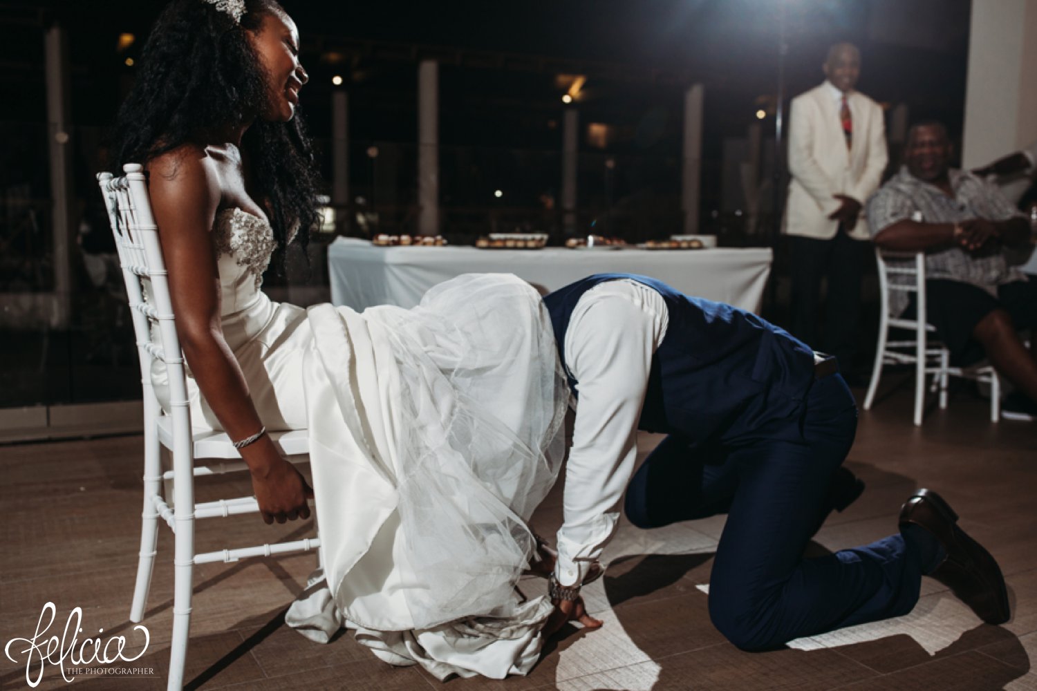   images by feliciathephotographer.com | destination wedding photographer | st lucia | l&s travel | the Royalton | reception | details | throwing the garter | white fitted gown | navy suit | 