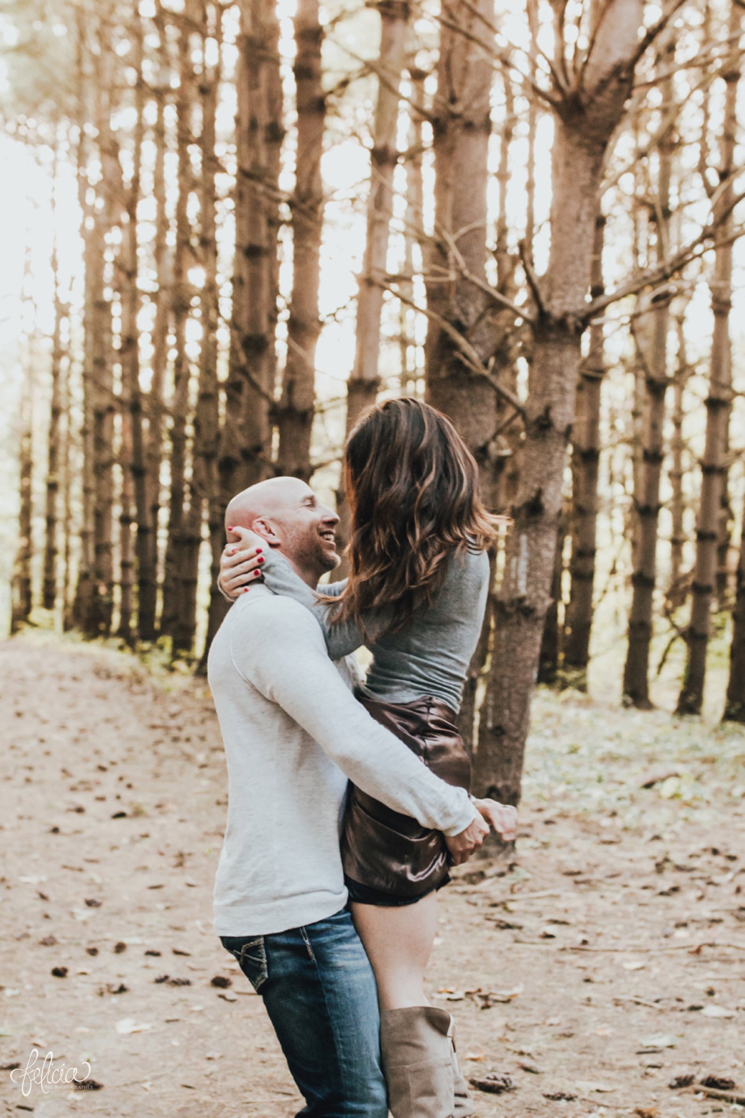 images by feliciathephotographer.com | destination wedding photographer | family portraits | fall attire | autumn | woodland setting | forest | casual | jeans | corduroy | sparkly boots | fur vest | toddlers | hipster | playful | parents and kiddos | father mother | lumber | romantic | couple | 