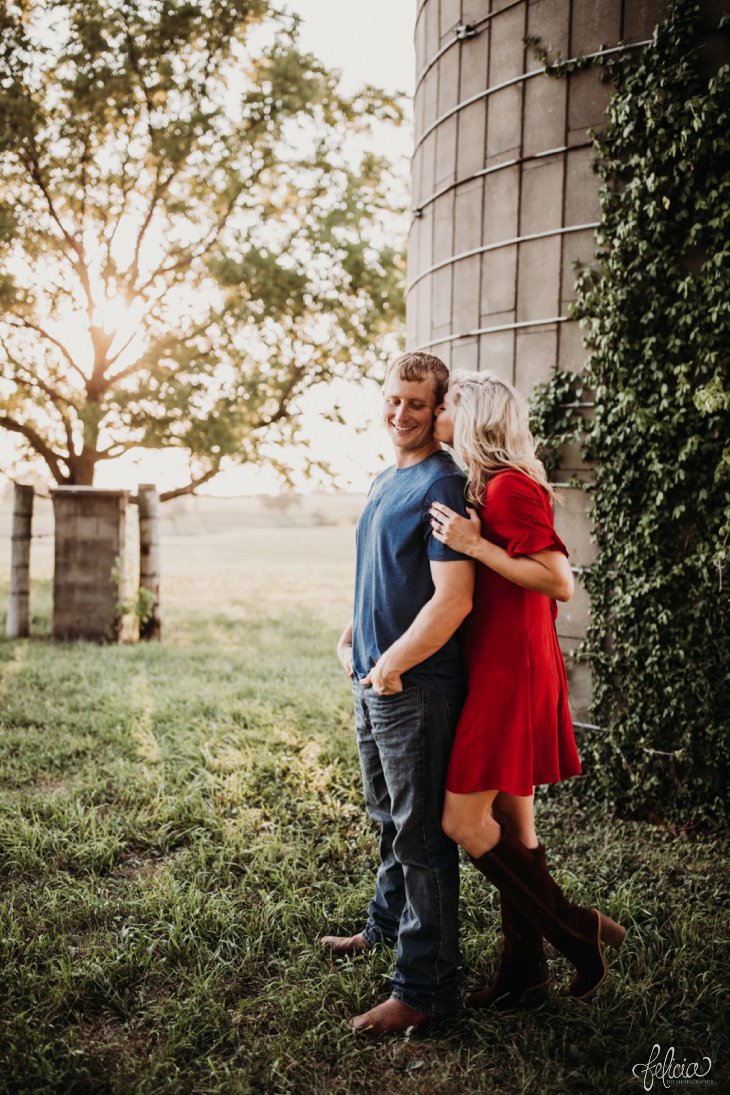 images by feliciathephotographer.com | destination wedding photographer | engagement | farmhouse | country | kansas city | sweet southern | red dress | nordstrom rack | unique halo diamond ring | casual | brown boots | amazon | cowboy | kiss | silos | 
