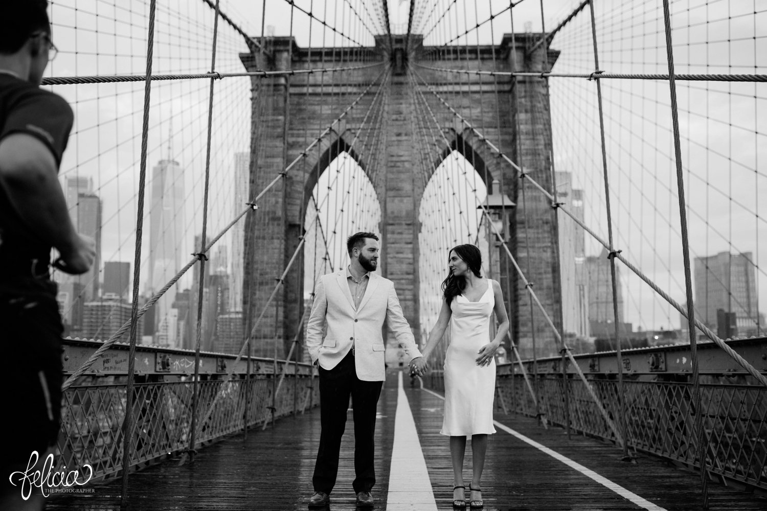 images by feliciathephotographer.com | destination wedding photographer | elopement | new york city | second look | brooklyn bridge | hand in hand | cowl neck dress | symmetry | contrast | skyline | 