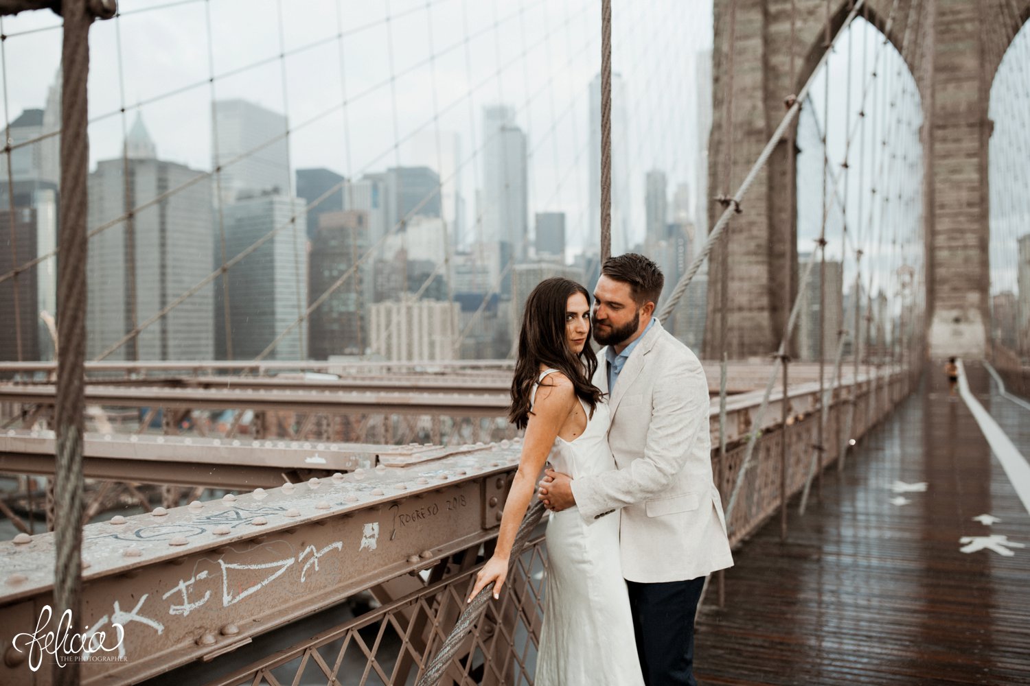 images by feliciathephotographer.com | destination wedding photographer | elopement | new york city | second look | brooklyn bridge | hand in hand | cowl neck dress | contrast | skyline | 