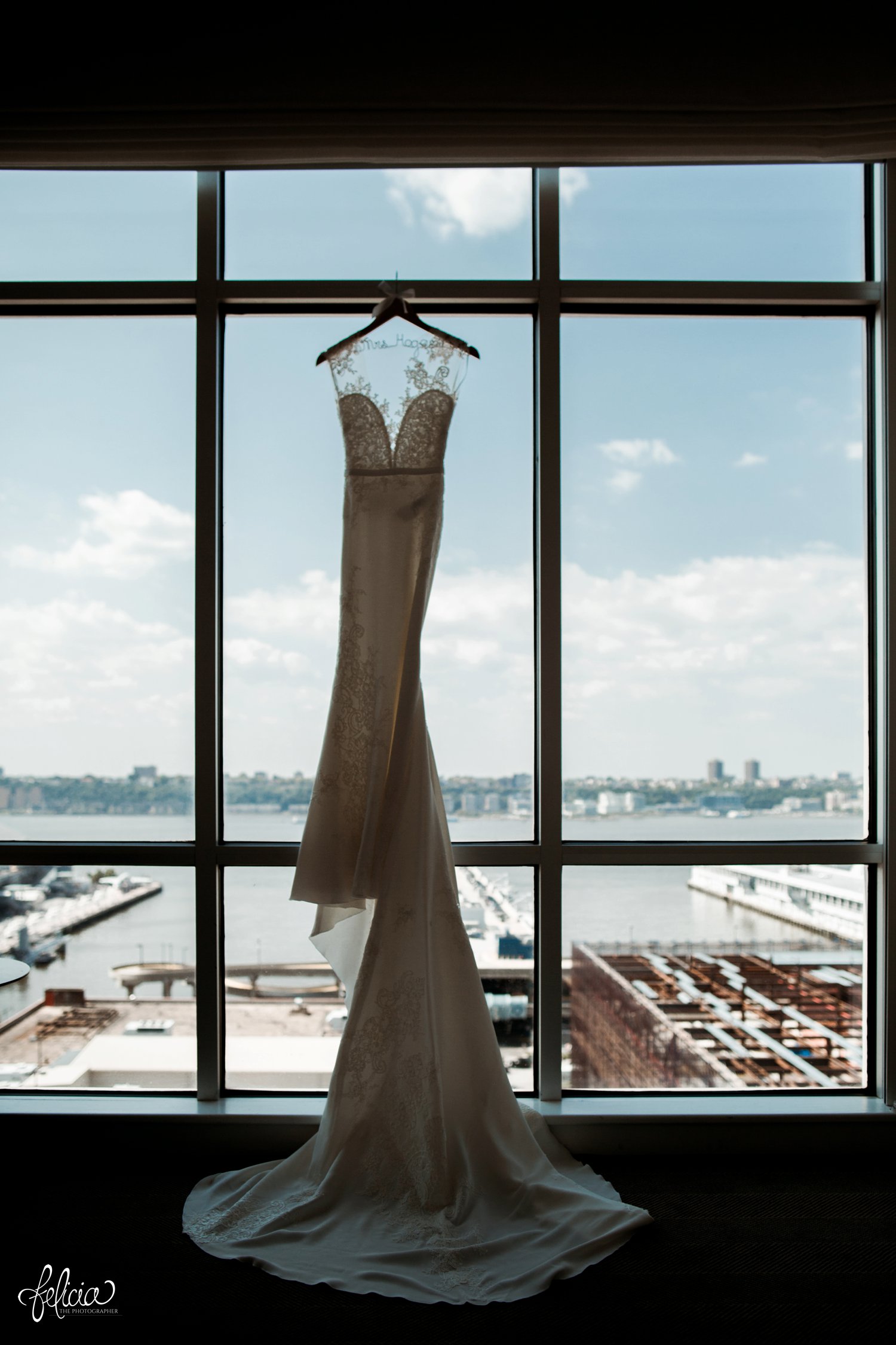 images by feliciathephotographer.com | destination wedding photographer | new york city | details | classic | hanging dress | nordstrom | pre ceremony | pronovias | lace neckline | long train | skyline | 