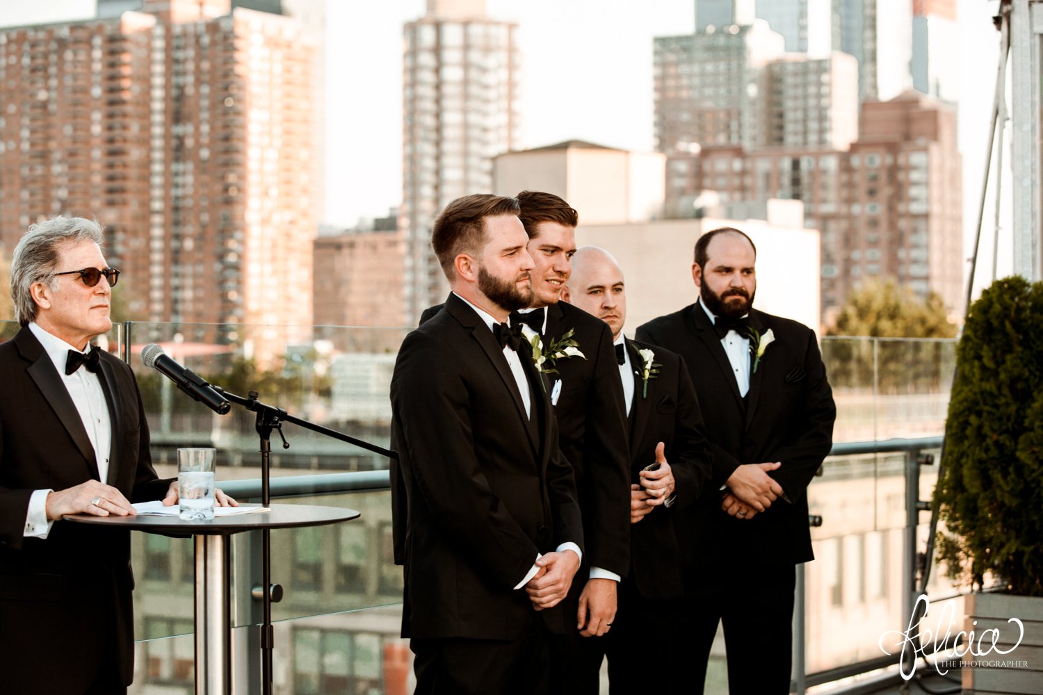images by feliciathephotographer.com | destination wedding photographer | new york city | ceremony | rooftop | skyline | urban | romantic | classic | groom waiting at the end of the aisle | black tuxedo | family | emotional | mens warehouse | 