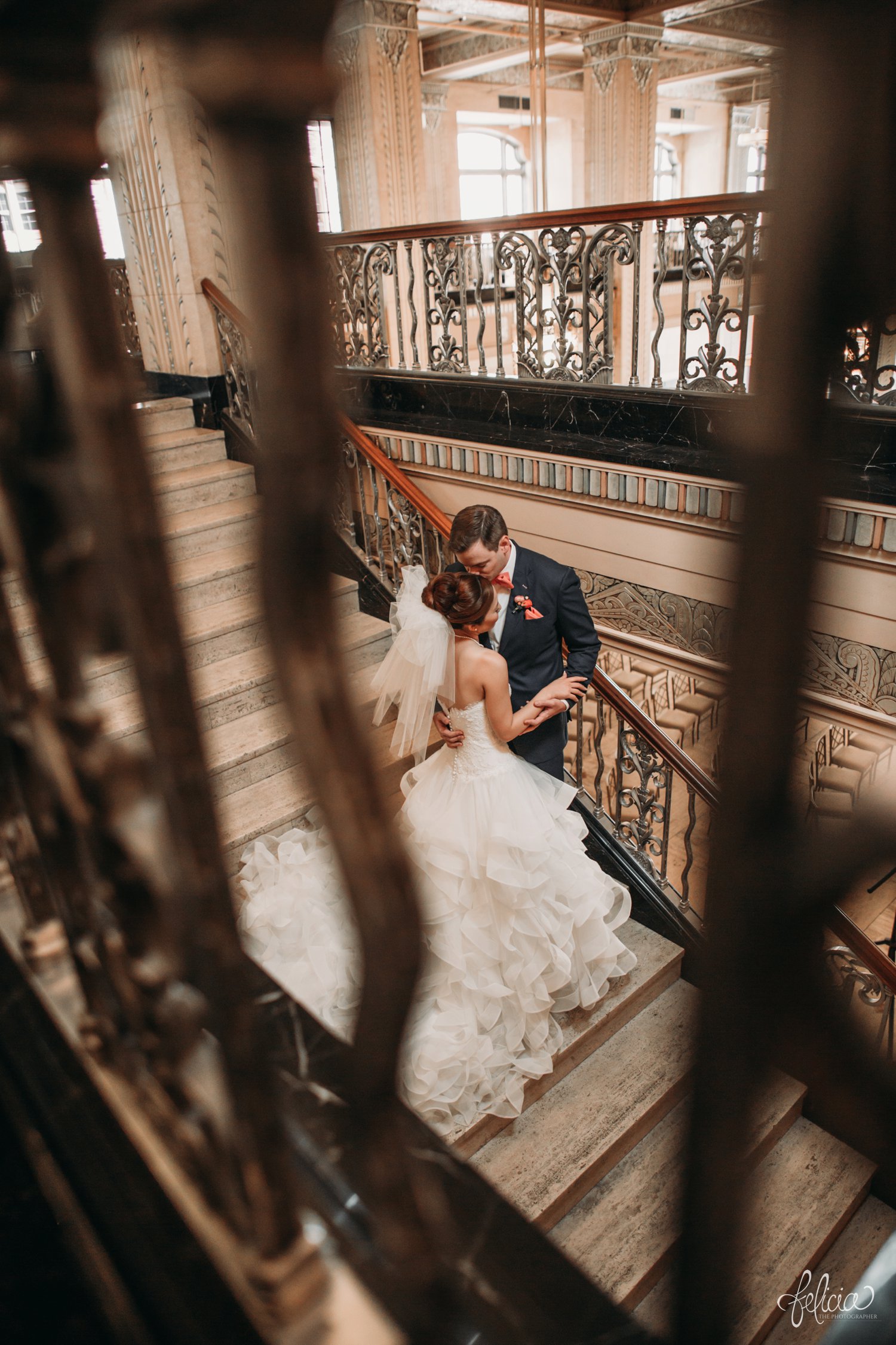 images by feliciathephotographer.com | destination wedding photographer | the grand hall at power and light | kansas city | missouri | downtown | glamorous | multicultural | details | first look | romantic | iron railings | peach bow tie | 
