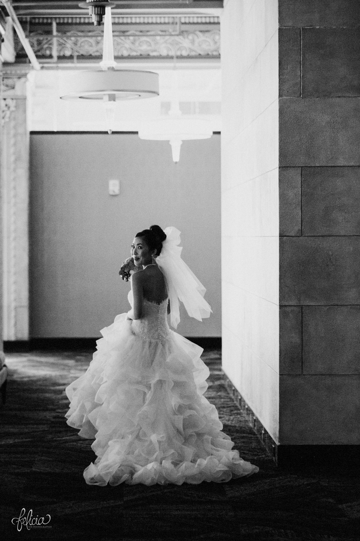 images by feliciathephotographer.com | destination wedding photographer | the grand hall at power and light | kansas city | missouri | downtown | glamorous | multicultural | black and white | details | getting ready | posh bridal | pearls | full skirt | pre ceremony | 