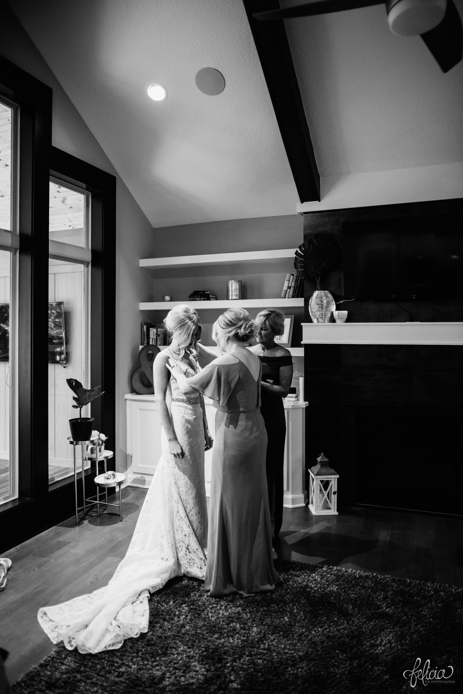 images by feliciathephotographer.com | destination wedding photographer | kansas city | getting ready | details | pre ceremony | putting on the dress | cross backed dress | fabulous frocks kc | lace skirt | black and white | 