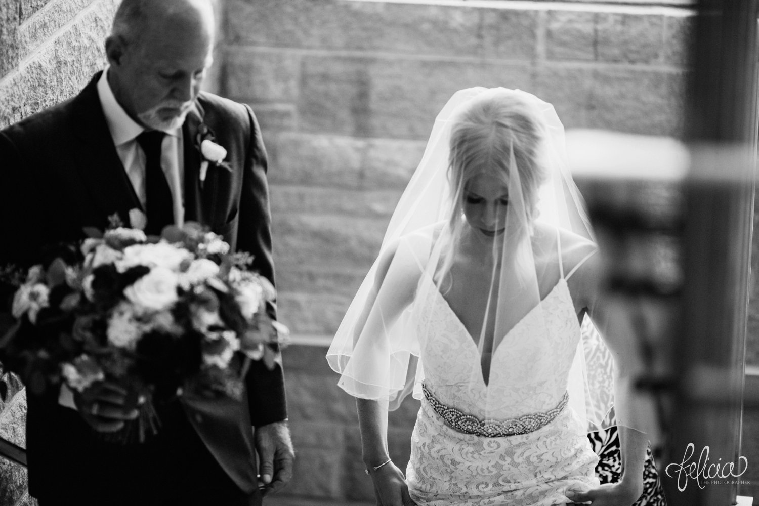 images by feliciathephotographer.com | destination wedding photographer | kansas city | ceremony | family | walking down the aisle | black and white | st charles borromeo | father of the bride | veil | lace dress | 