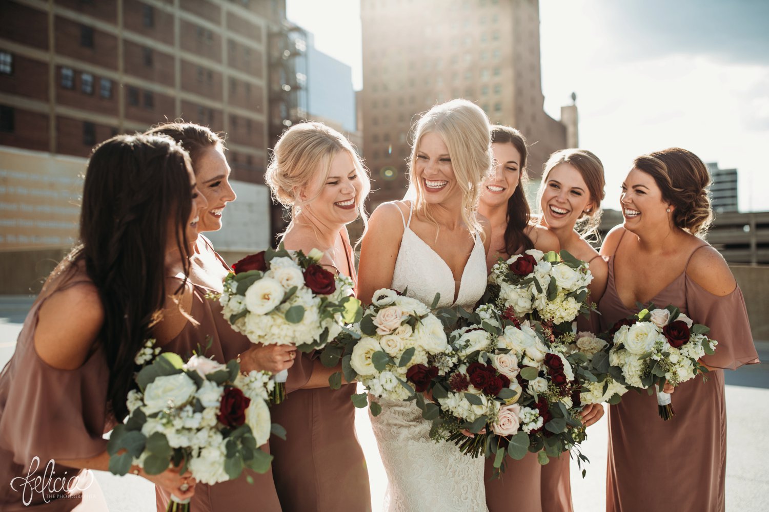 images by feliciathephotographer.com | destination wedding photographer | kansas city | best friends | laughter | natural light | mauve | light pink and red | bella bridesmaids | lace gown | fabulous frocks | full dramatic florals | wild hill | rooftop | urban | 