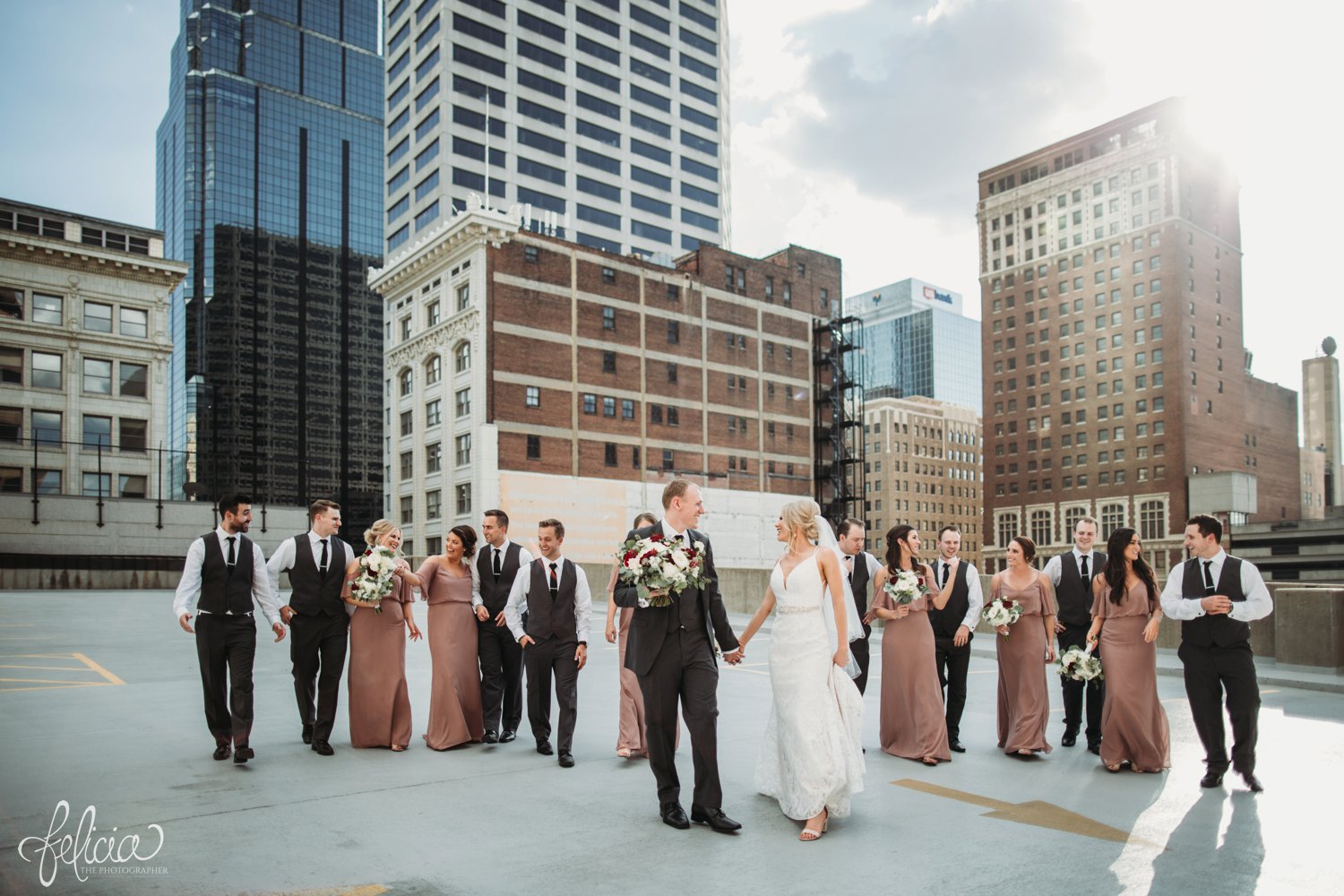 images by feliciathephotographer.com | destination wedding photographer | kansas city | best friends | laughter | natural light | mauve | light pink and red | bella bridesmaids | lace gown | fabulous frocks | full dramatic florals | wild hill | rooftop | urban | groomsmen | grey suit | tip top tux | 