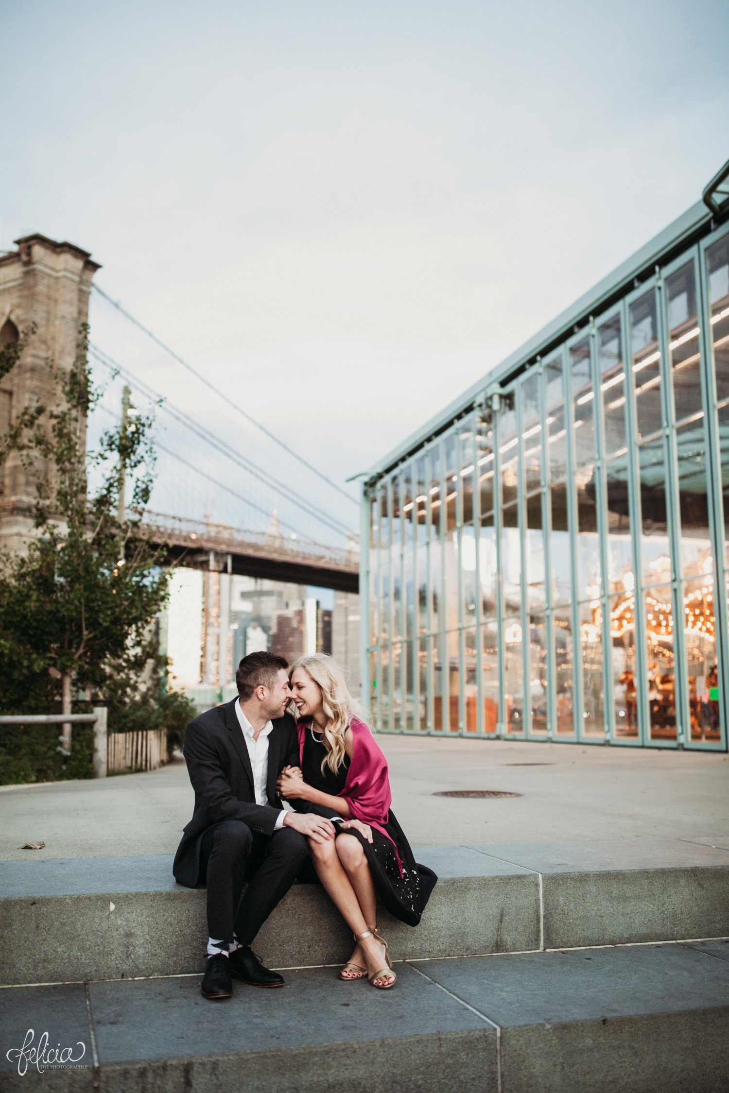 images by feliciathephotographer.com | destination wedding photographer | engagement | new york city | brooklyn bridge | skyline | formal | classic | true love | romantic | symmetry | carnival | merry go round | circus | cuddles | pink shawl | 