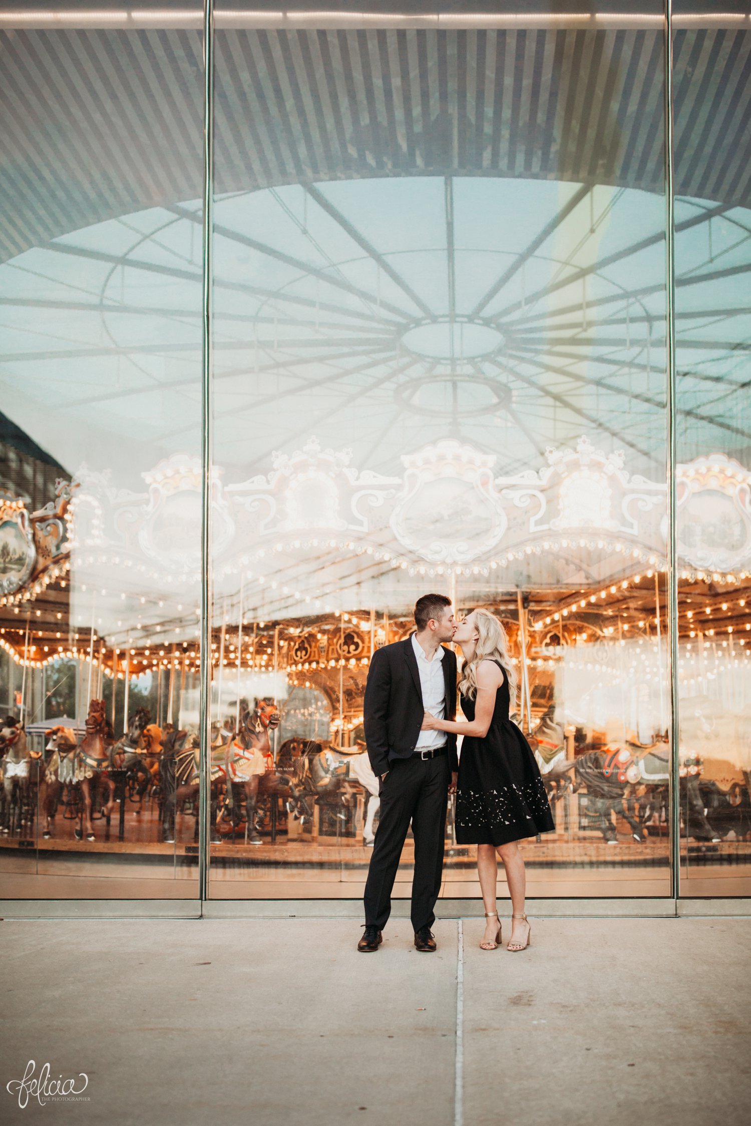 images by feliciathephotographer.com | destination wedding photographer | engagement | new york city | brooklyn bridge | skyline | formal | classic | true love | romantic | symmetry | carnival | merry go round | circus | kiss | 
