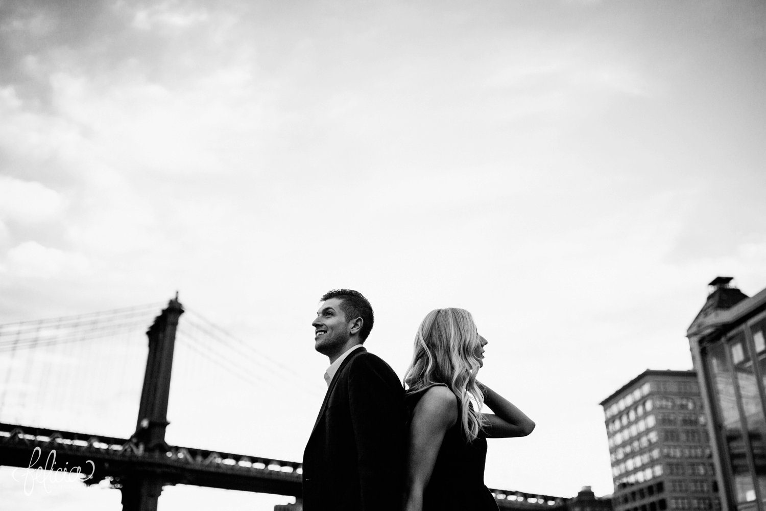 images by feliciathephotographer.com | destination wedding photographer | engagement | new york city | brooklyn bridge | skyline | formal | classic | true love | romantic | black and white | symmetry | back to back | 