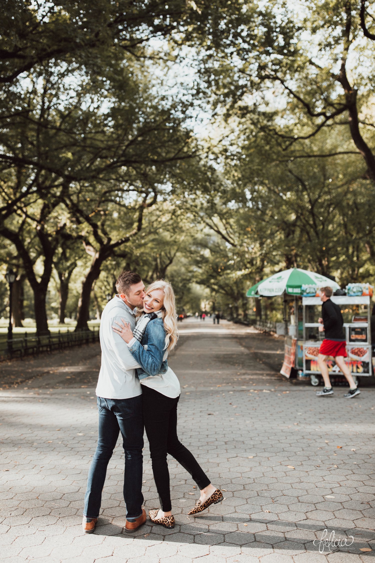 images by feliciathephotographer.com | destination wedding photographer | engagement | new york city | central park | casual | classic | true love | romantic | diamond ring | urban | joyful | cheetah shoes | scarf | sweet | trees | hot dog vender | 