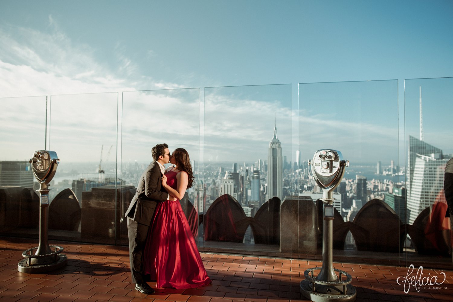 images by feliciathephotographer.com | destination wedding photographer | engagement | new york city | skyline | downtown | urban | formal | classic | elegant | long red gown | suit and tie | top of the rock | sunrise | elegant | glam | kiss | 