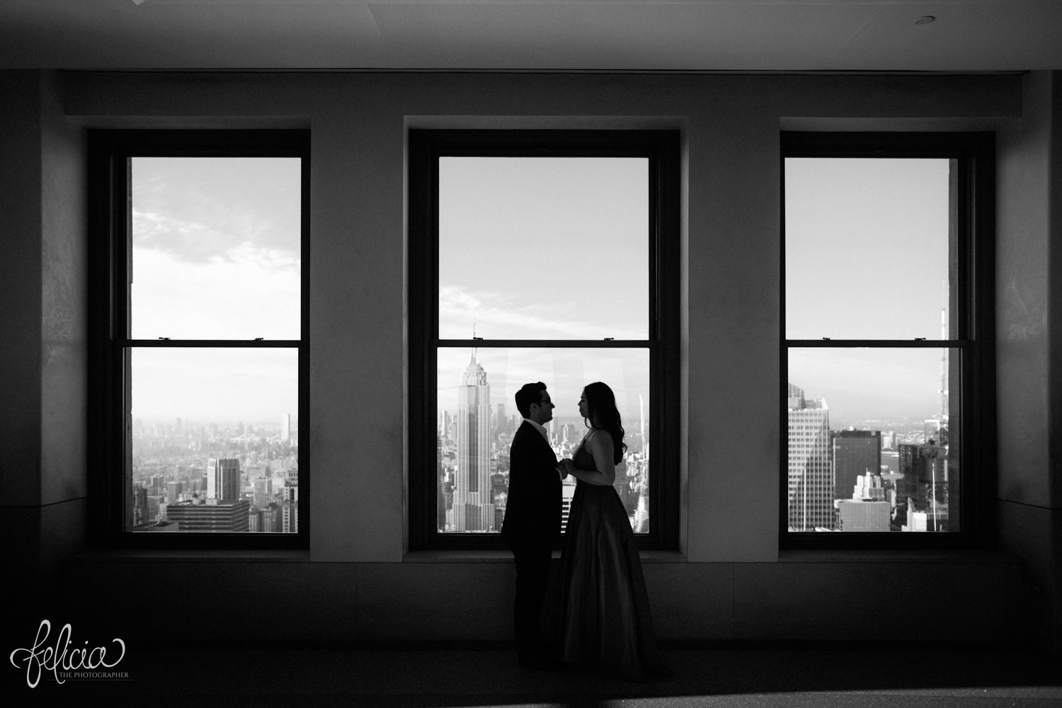 images by feliciathephotographer.com | destination wedding photographer | engagement | new york city | skyline | downtown | urban | formal | classic | elegant | long red gown | suit and tie | top of the rock | sunrise | elegant | glam | black and white | 