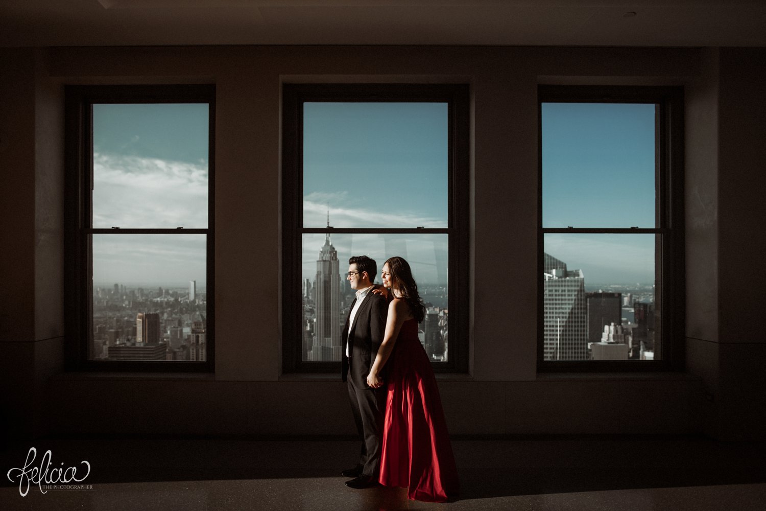 images by feliciathephotographer.com | destination wedding photographer | engagement | new york city | skyline | downtown | urban | formal | classic | elegant | long red gown | suit and tie | top of the rock | sunrise | elegant | glam | 