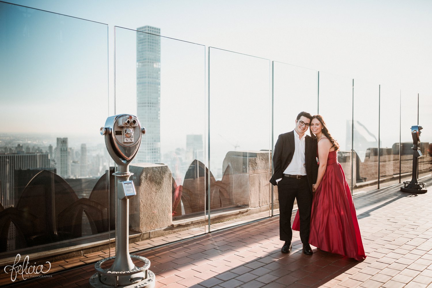 images by feliciathephotographer.com | destination wedding photographer | engagement | new york city | skyline | downtown | urban | formal | classic | elegant | long red gown | suit and tie | top of the rock | sunrise | elegant | glam | kiss | romantic |