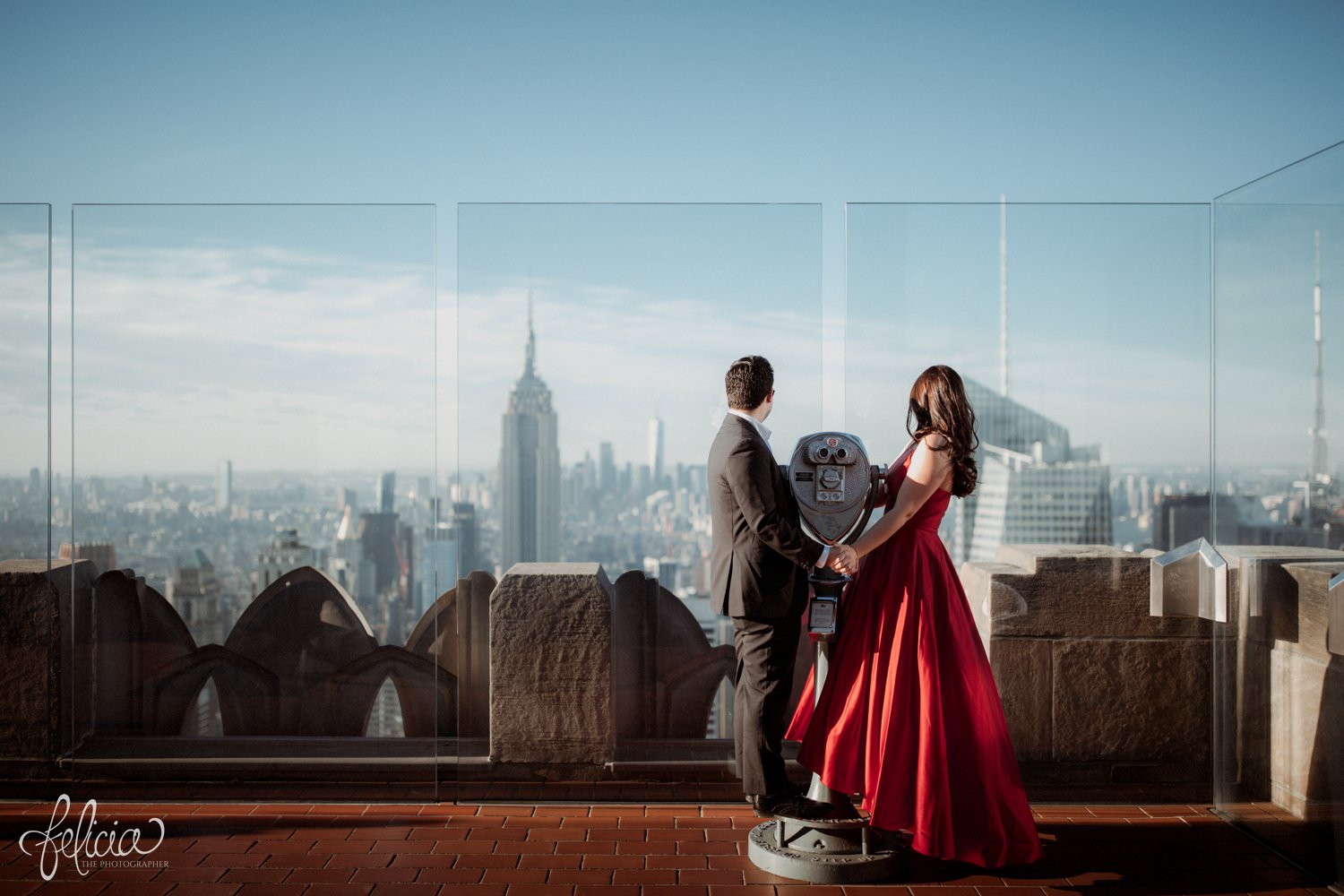 images by feliciathephotographer.com | destination wedding photographer | engagement | new york city | skyline | downtown | urban | formal | classic | elegant | long red gown | suit and tie | top of the rock | sunrise | elegant | glam | kiss | romantic |
