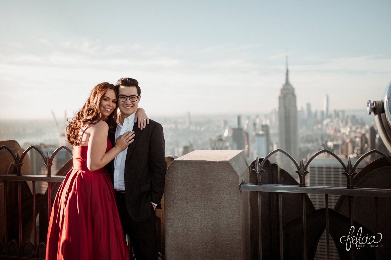 images by feliciathephotographer.com | destination wedding photographer | engagement | new york city | skyline | downtown | urban | formal | classic | elegant | long red gown | suit and tie | top of the rock | sunrise | elegant | glam | kiss | 