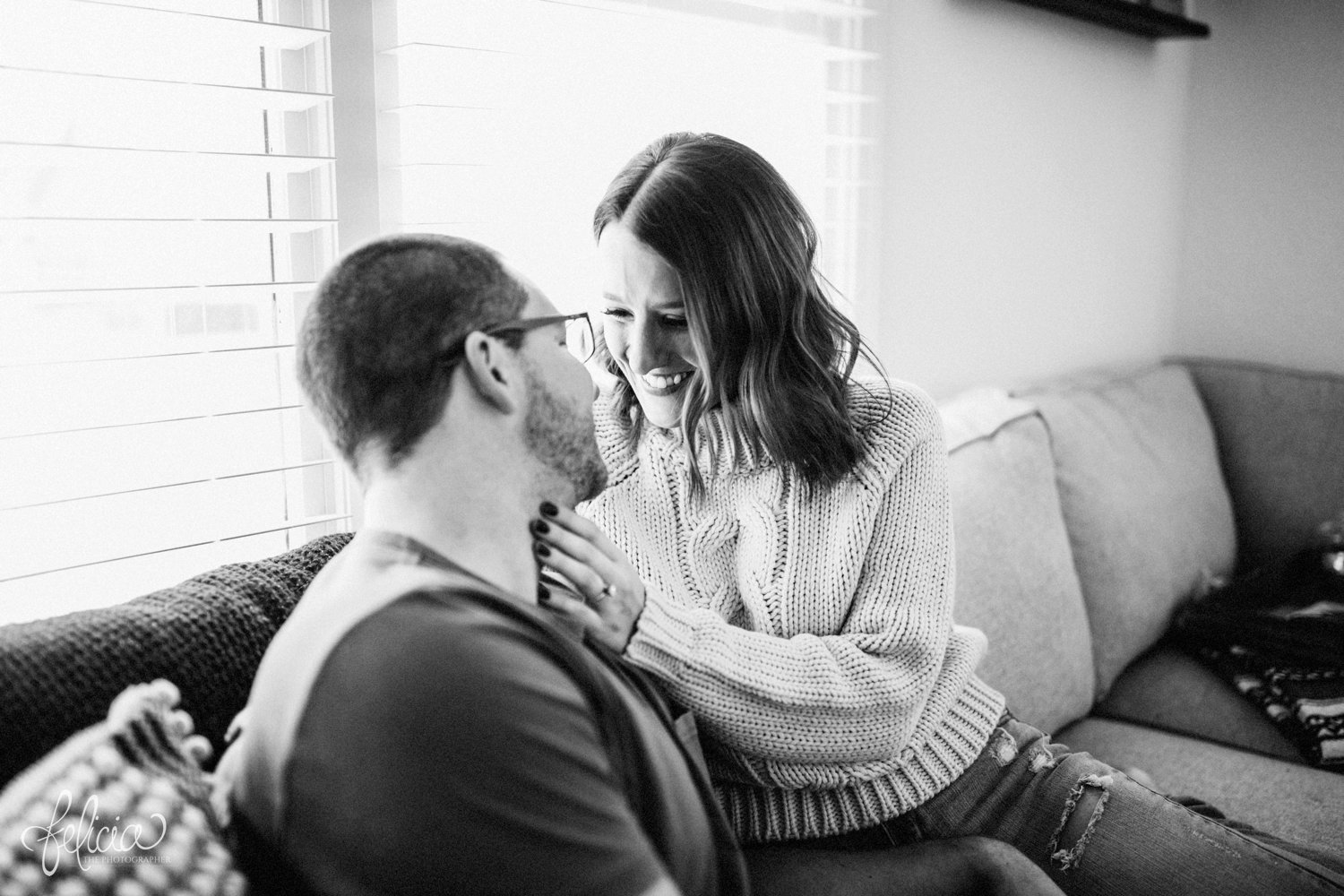 images by feliciathephotographer.com | destination photographer | engagement session | in home | lifestyle | kansas city | cozy | casual | snuggles | couch | black and white | love | joy | 