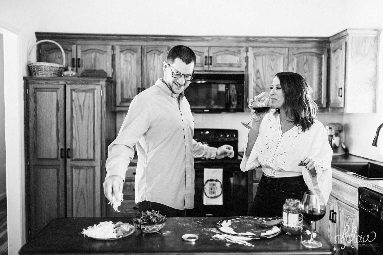 images by feliciathephotographer.com | destination photographer | engagement session | in home | lifestyle | kansas city | cooking from scratch | ingredients | crust | pizza | flour | details | romantic | black and white | silly | playful |