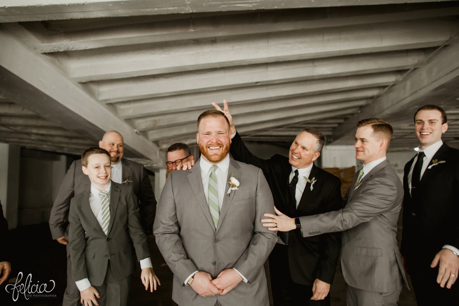 images by feliciathephotographer.com | magnolia venue | urban garden wedding | photographer | kansas city missouri | candid | concrete | the groomsmen suit | grey and green | wild hill flowers | family | industrial | silly | 