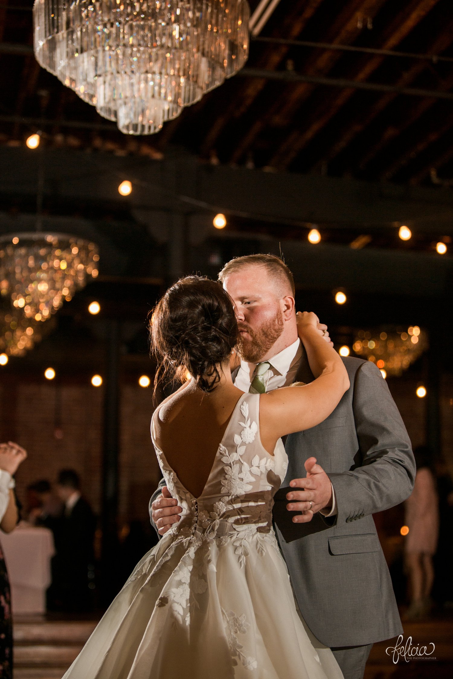 images by feliciathephotographer.com | magnolia venue | urban garden wedding | photographer | kansas city missouri | details | chandelier | first dance | mr and mrs | romantic | floral lace gown | something white bridal boutique | the groomsman suit | grey and green | 