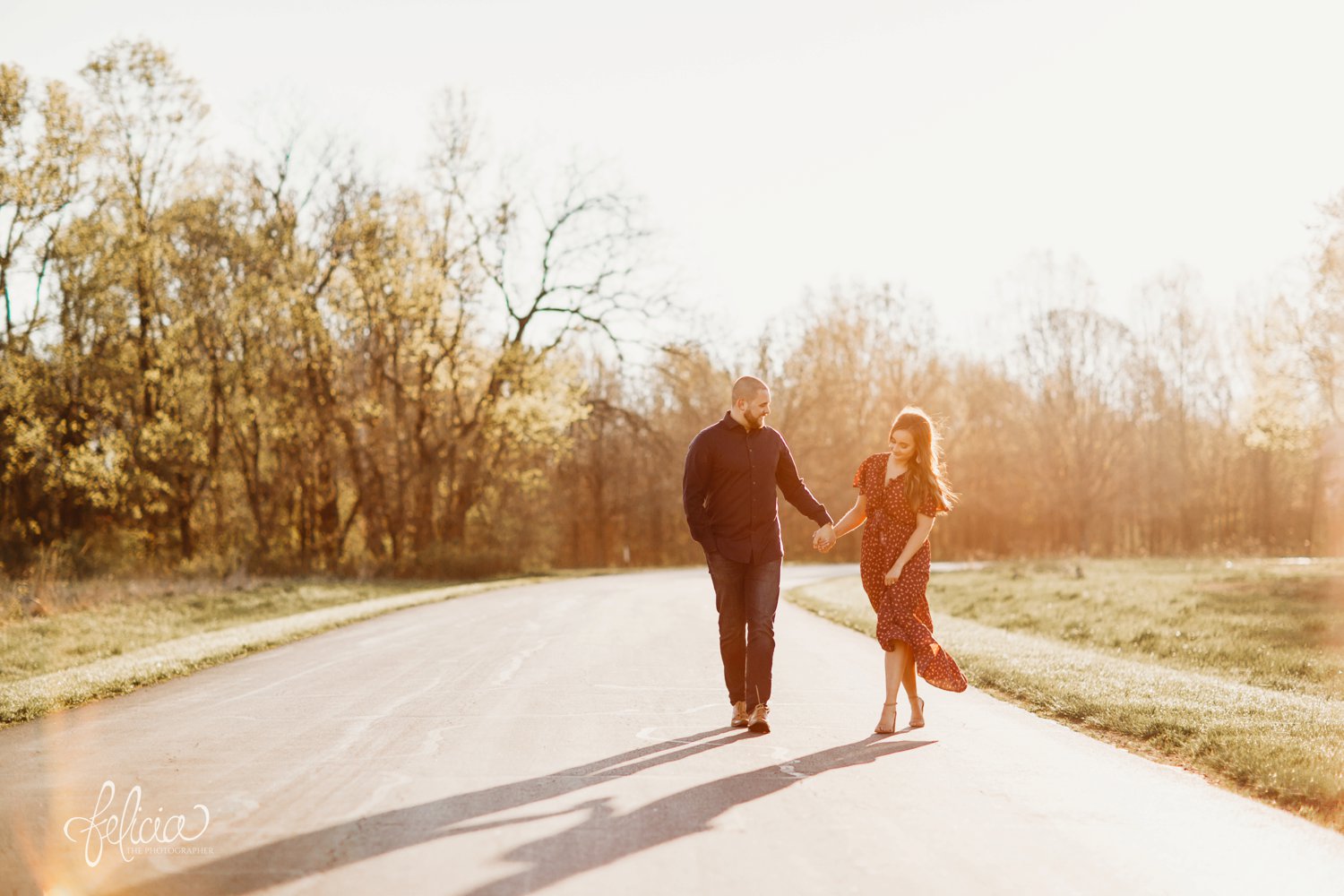 images by feliciathephotographer.com | Burr Oak Woods | engagement photos | wedding photographer | engagement photographer | field | sunrise | road | walking | holding hands | candid | posed | posing | smiling | laughing | laughter | love | happy | 
