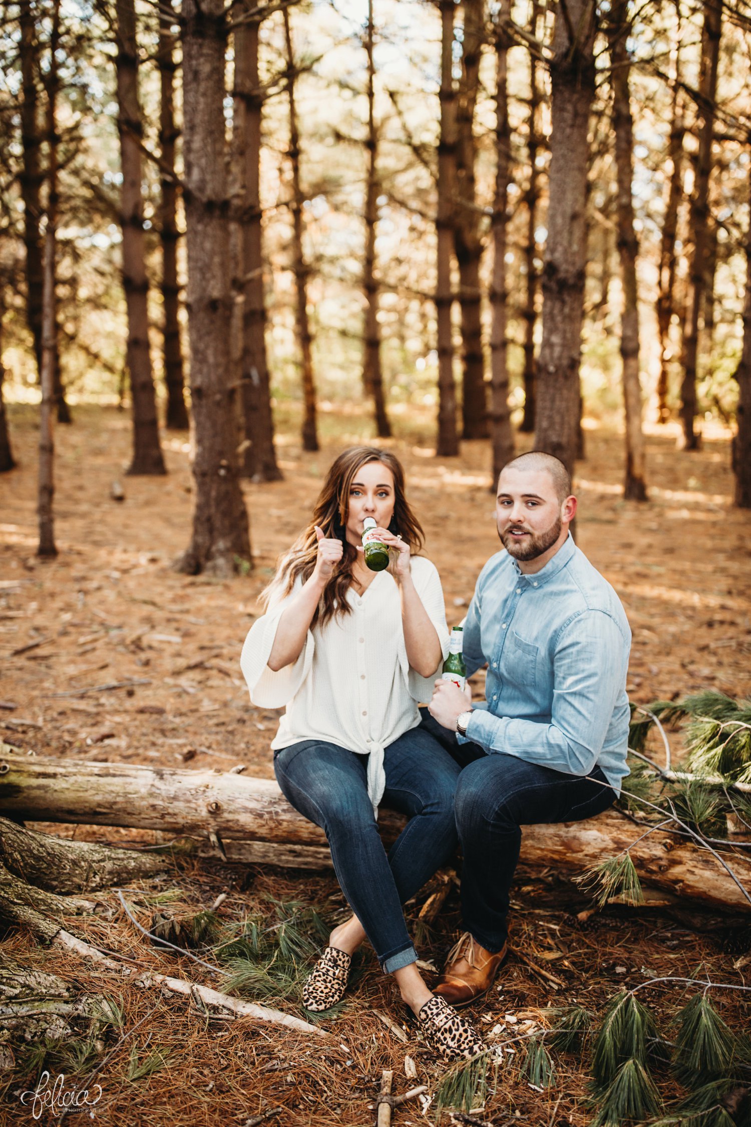 images by feliciathephotographer.com | The Forest | engagement photos | wedding photographer | engagement photographer | forest | sunrise | thumbs up | cheetah print | shoes | brown | blue jeans | beer | drink | drinking | candid | 