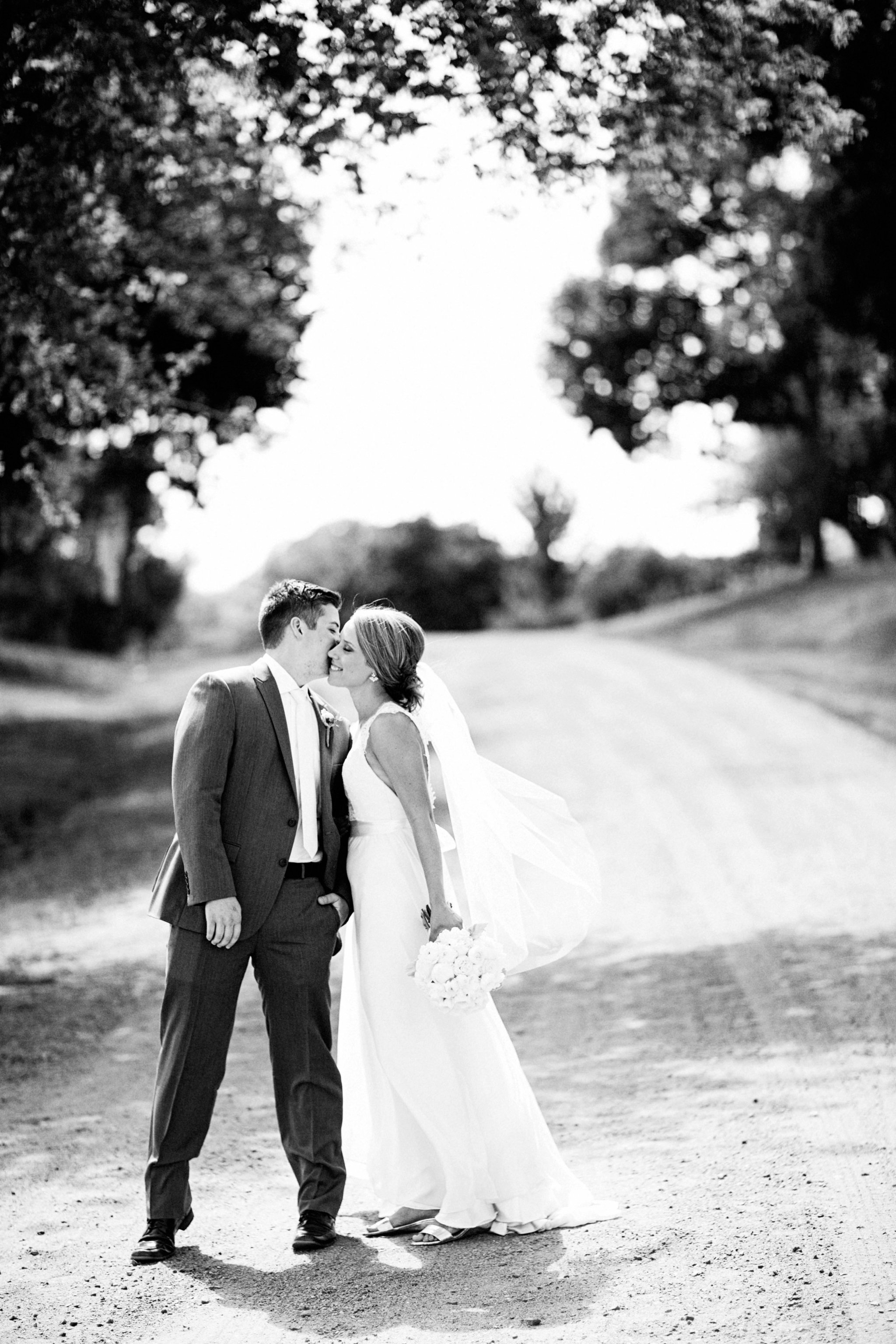 Sioux Falls Wedding Photos | Destination Photographer | Felicia The Photographer | Mary Jo Wegner Arboretum | Bride and Groom | Dirt Road | Black and White