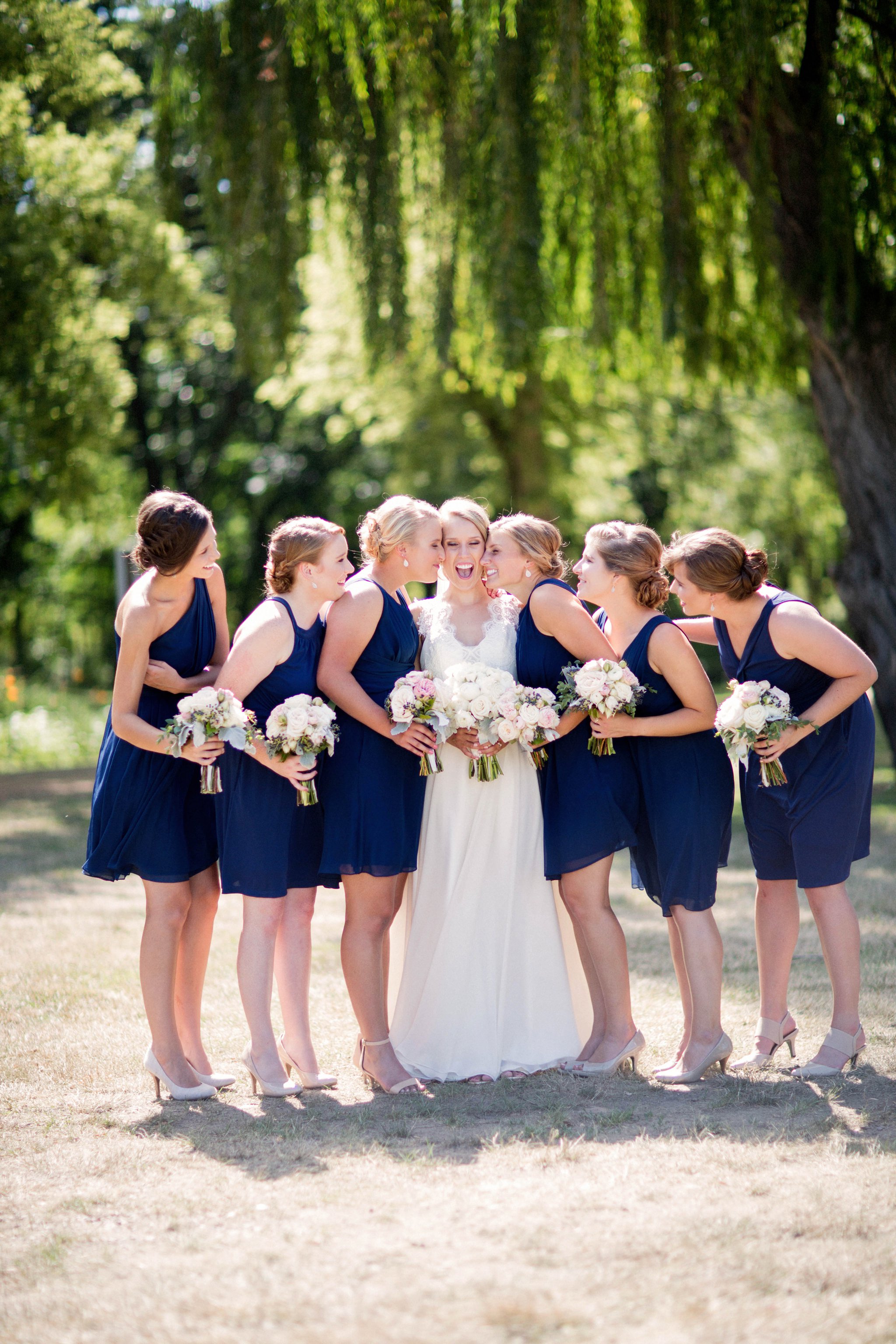 Sioux Falls Wedding Photos | Destination Photographer | Felicia The Photographer | Mary Jo Wegner Arboretum | Bridesmaids Cute | Fun | Candid | Navy short one shoulder dresses