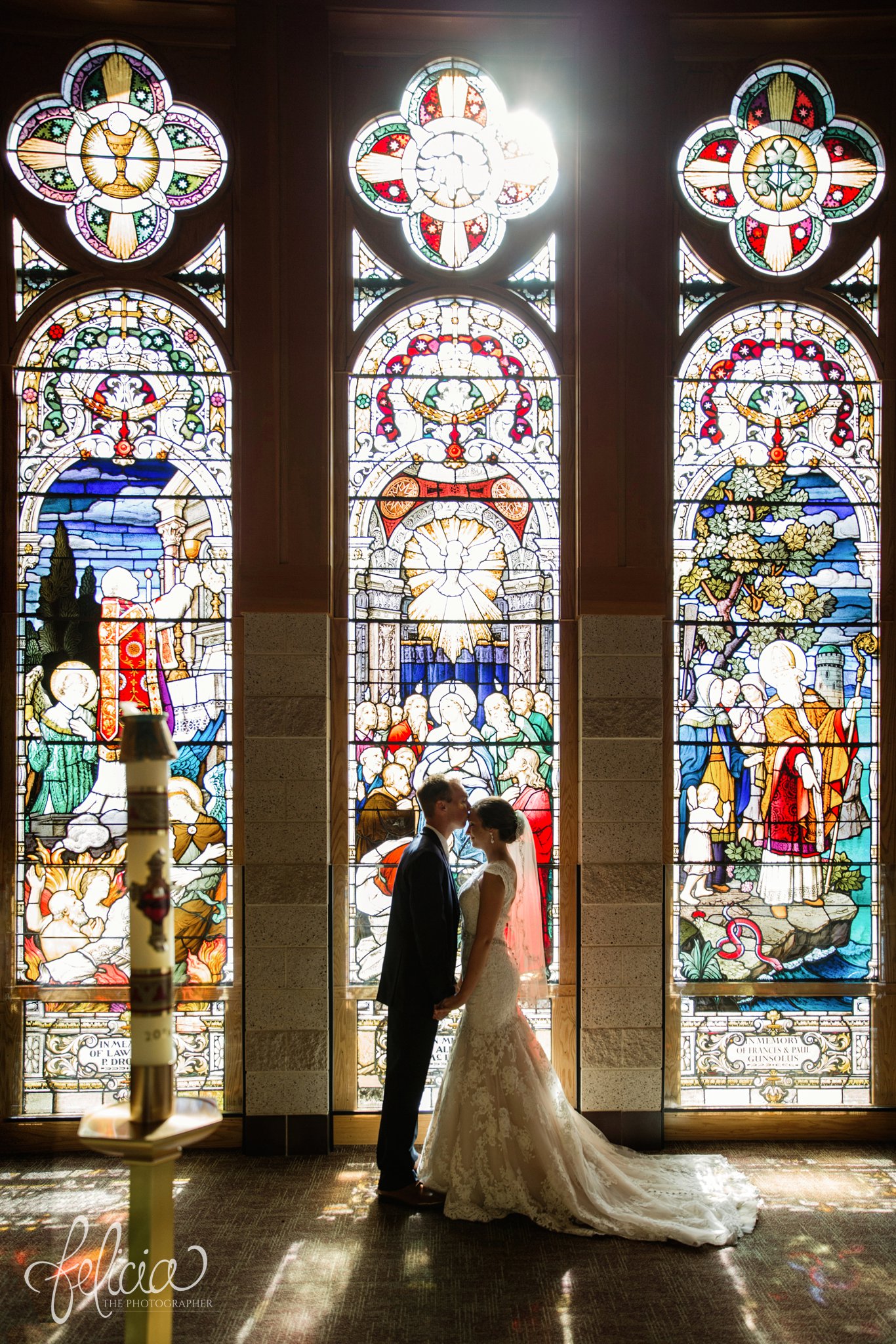 Wedding | Wedding Photography | Wedding Photos | Felicia the Photographer | Images by feliciathephotographer.com | Travel Photographer | Duluth | St. Benedict Church | Stained Glass Windows | Sun Flare | Bride and Groom Portrait | Forehead Kiss | Profile 