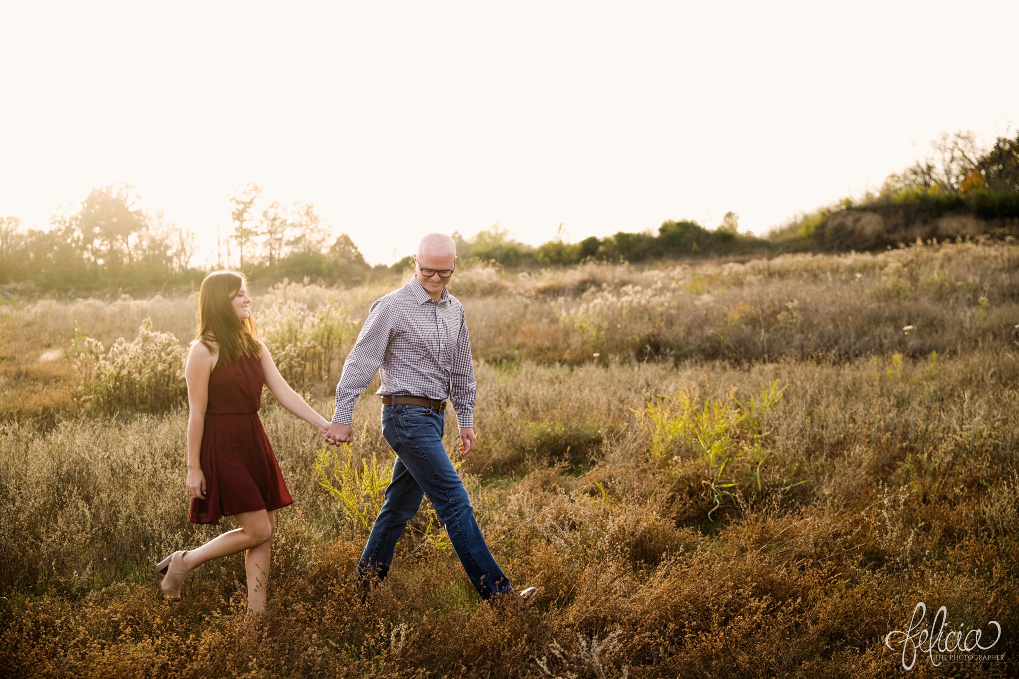 engagement pictures | engagement photos | nature | golden hour | sunset | sunset photography | walking in a field | fall | autumn | burgundy 