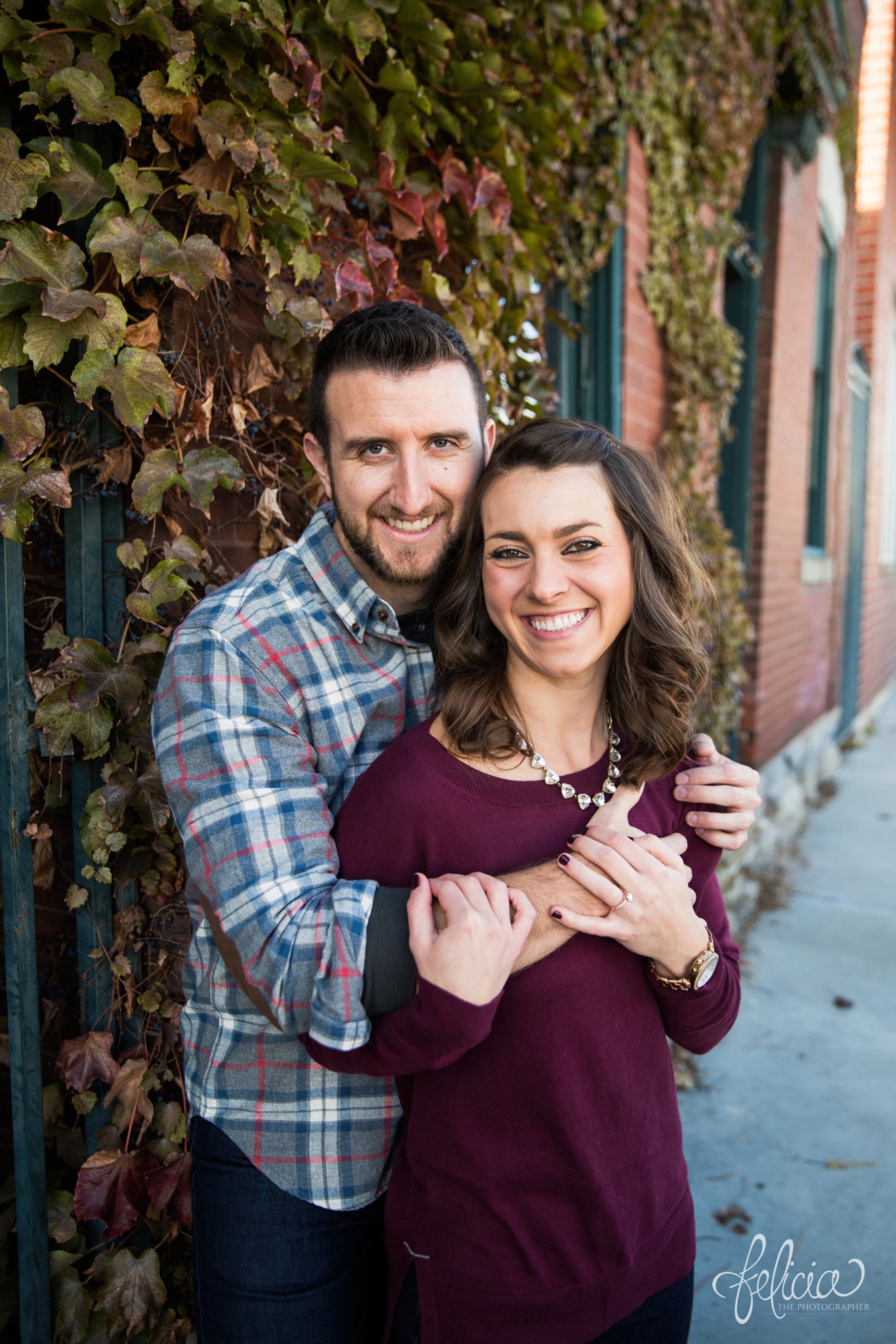 images by feliciathephotographer.com | engagement photos | engagement photography | Kansas City | West Bottoms | images by feliciathephotographer.com | urban setting | industrial background | brick | gold accessories 