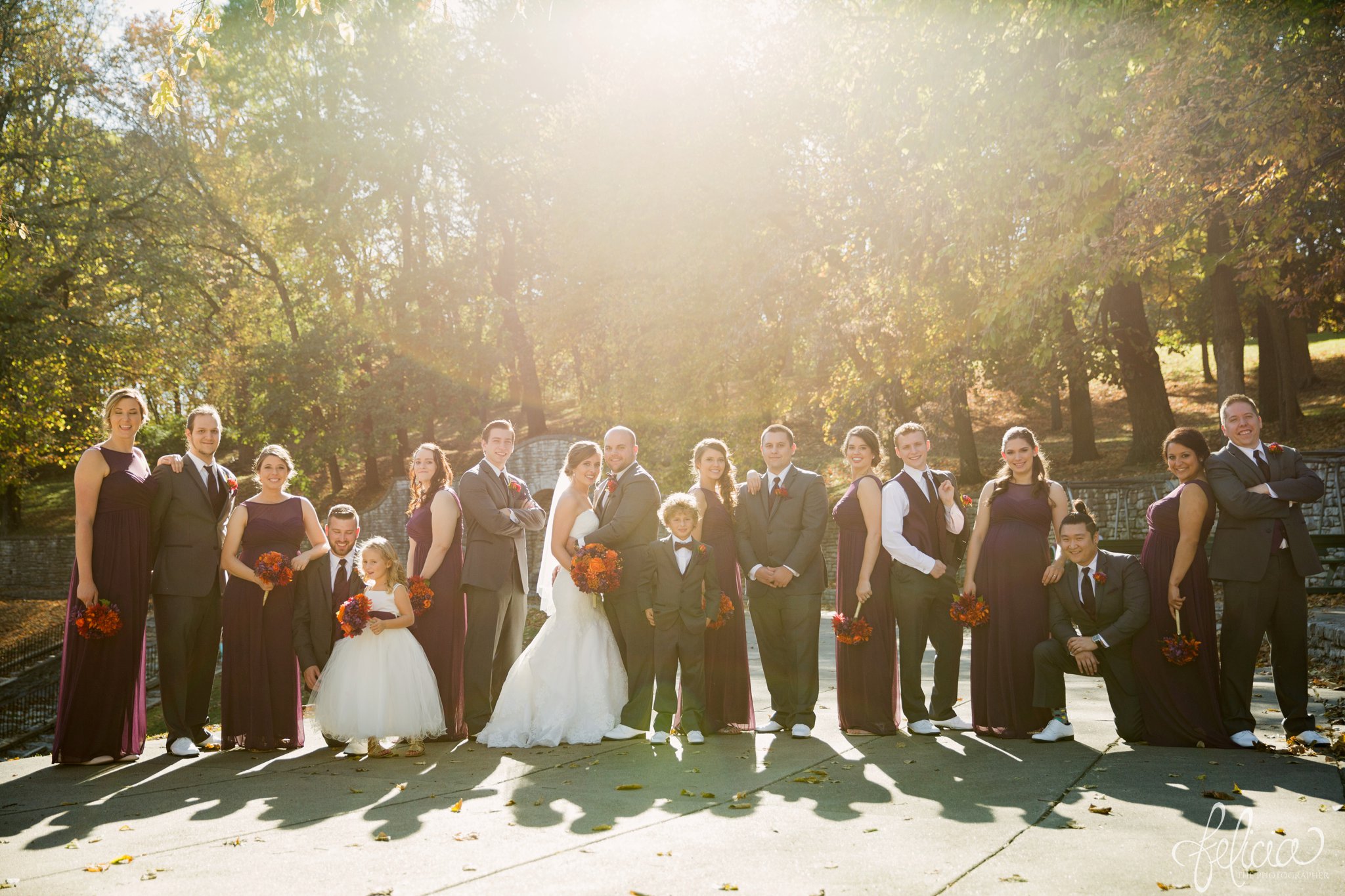 weddings | wedding photography | wedding photos | images by feliciathephotographer.com | St. Francis Xavier Church | Moila Country Club | autumn wedding | fall wedding | fall colors | harvest | purple and orange | Kansas City | St. Joseph | harvest inspiration | bridal party portraits | sun flare | nature | fall leaves 