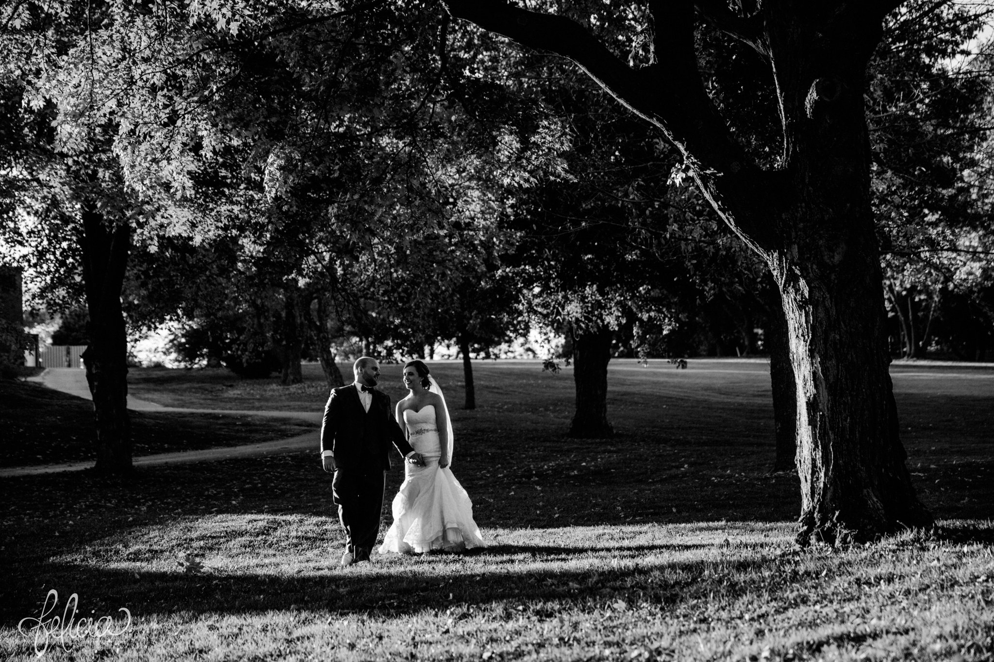 black and white |weddings | wedding photography | wedding photos | images by feliciathephotographer.com | St. Francis Xavier Church | Moila Country Club | autumn wedding | fall wedding | fall colors | harvest | purple and orange | Kansas City | St. Joseph | harvest inspiration | bride and groom portrait | outdoor | golden hour | oak trees | walking through nature | hand hold | candid 