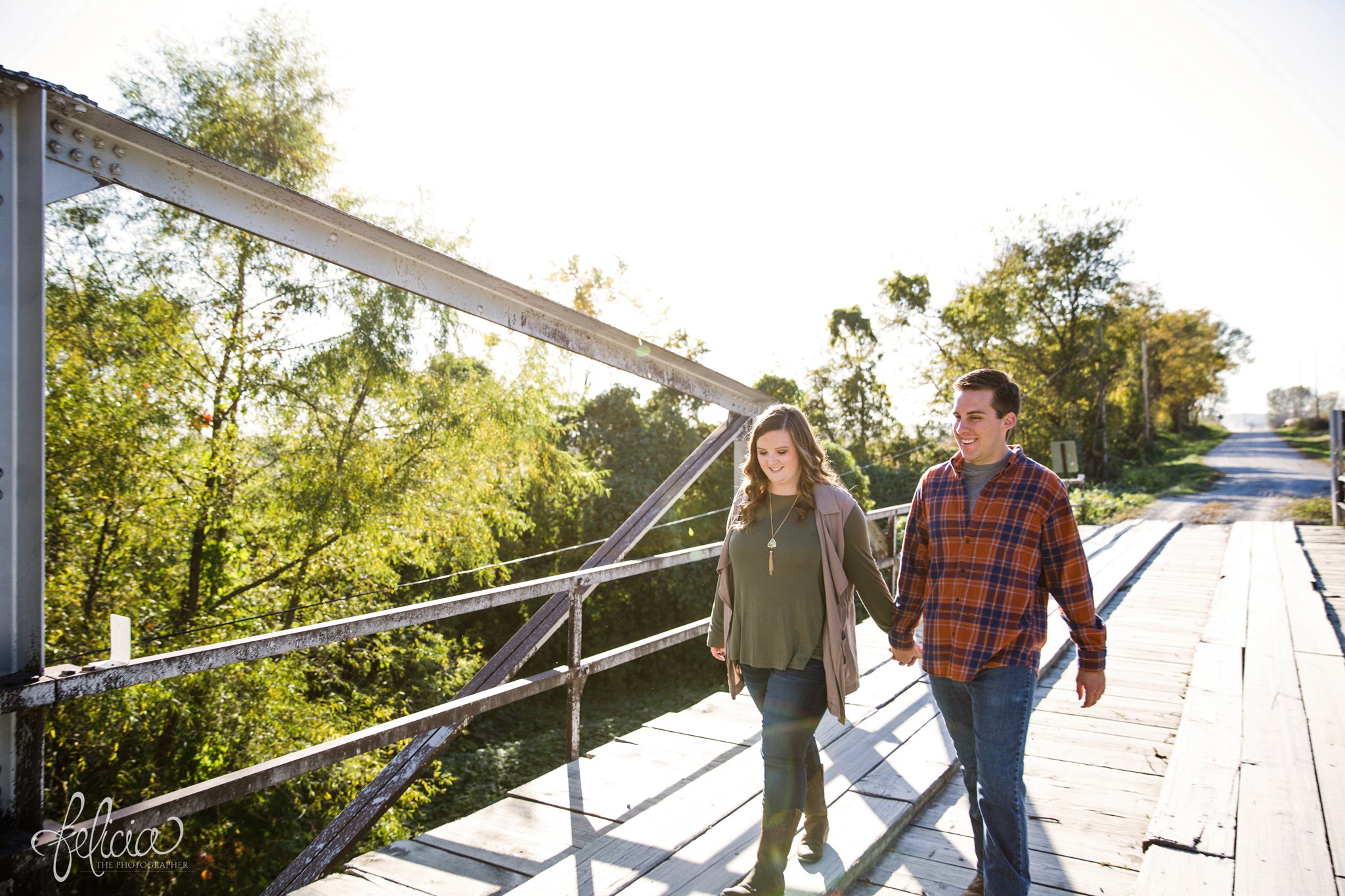 engagement photos | engagement photography | Felicia the Photographer | images by feliciathephotographer.com | sun flare | farm | nature | holding hands | crossing bridge 