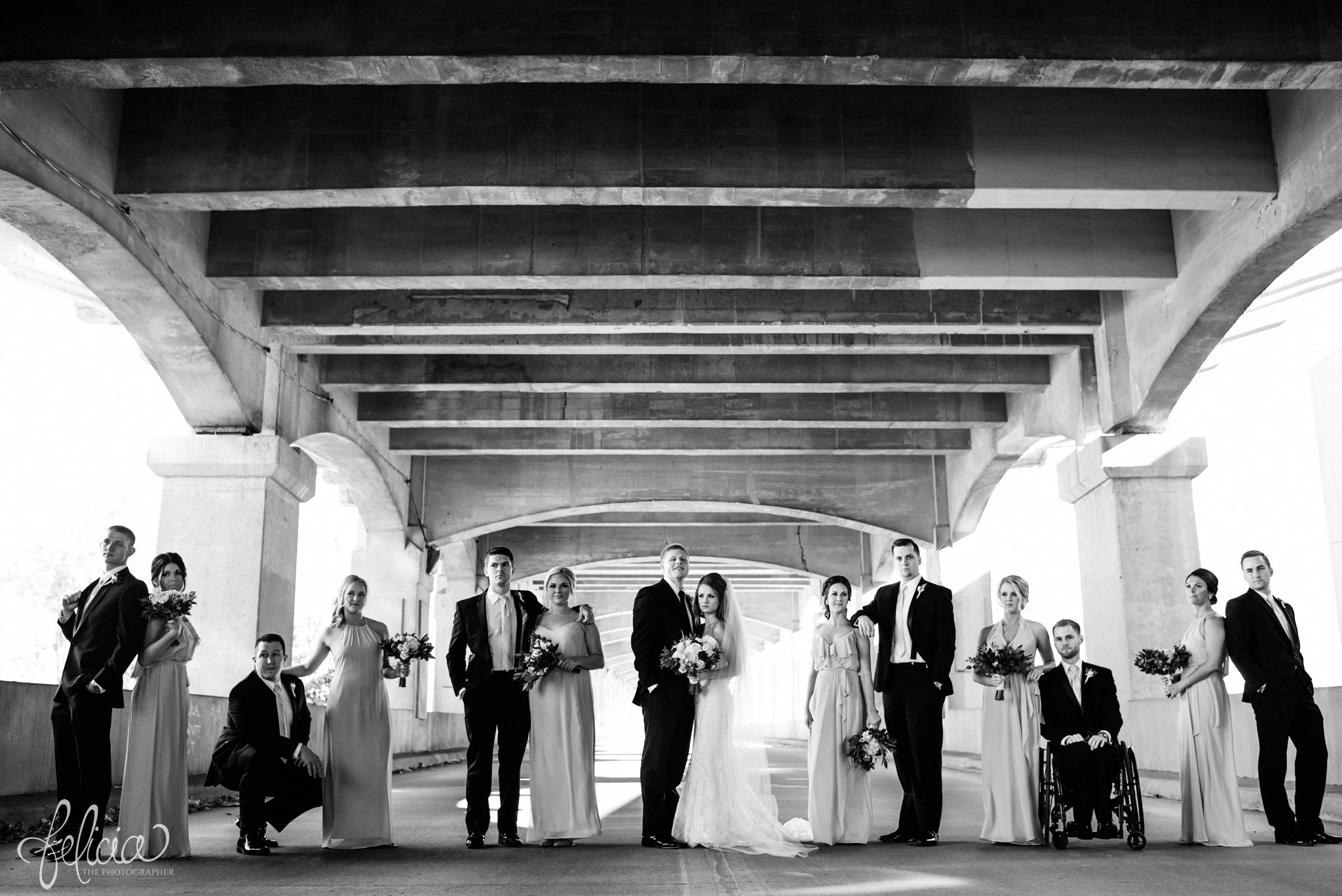 black and white | wedding | wedding photos | industrial | Rumely Event Space | wedding photography | images by feliciathephotographer.com | West Bottoms | industrial background | bridal party | unique poses 