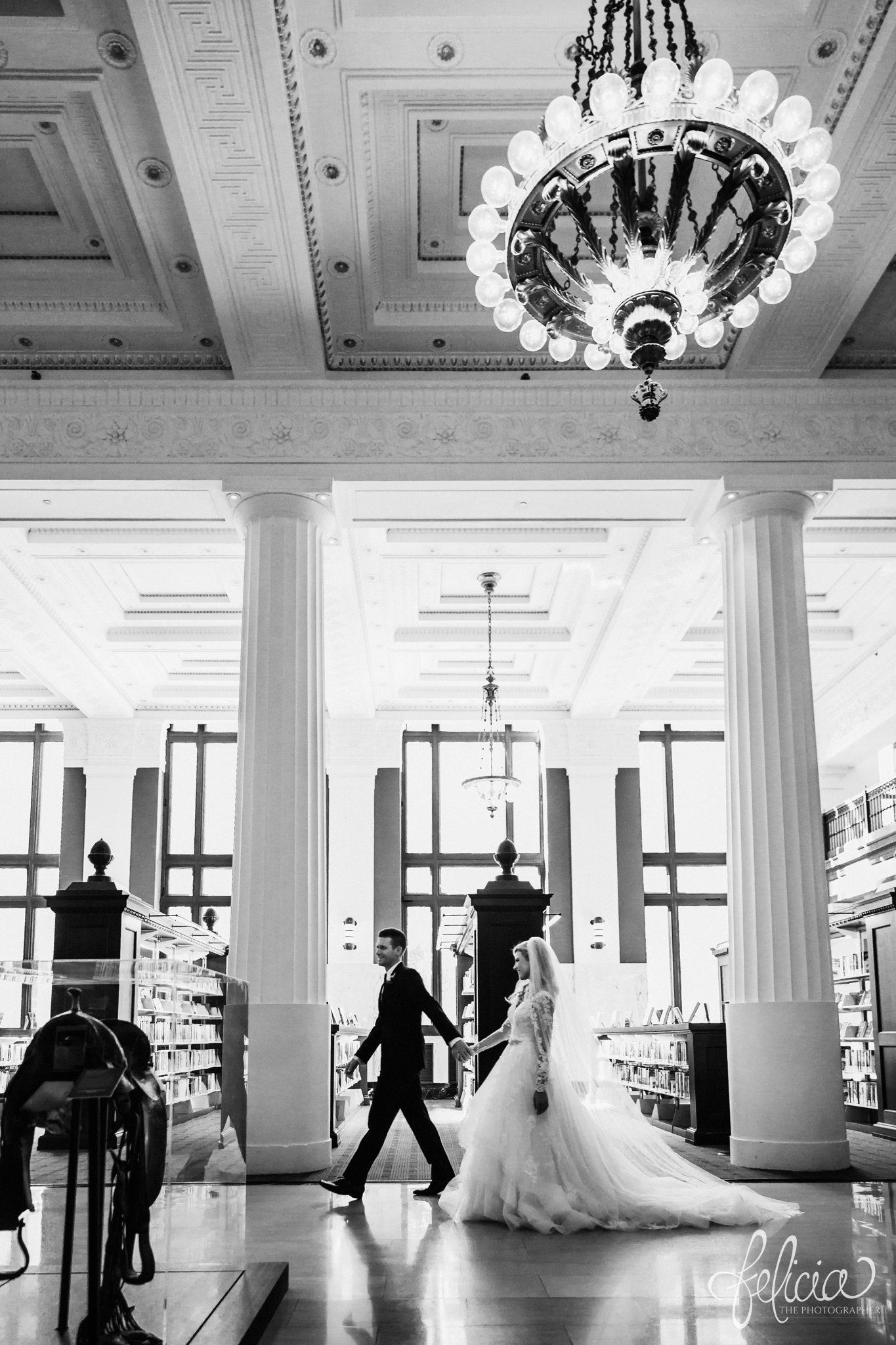images by feliciathephotographer.com | wedding photographer | kansas city | redemptorist | classic | whimsical | library | holding hands | romantic | true love | lace dress | belle vogue | black and white | chandelier | 