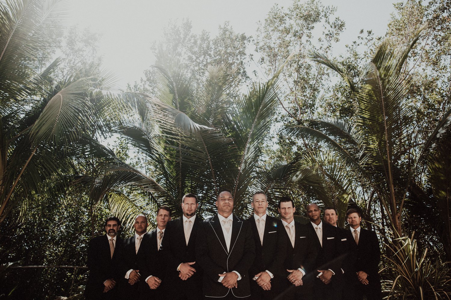  images by feliciathephotographer.com | destination wedding photographer | el dorado riviera maya | glamorous | beachside | resort | groomsmen portraits | palm trees | game face | the black tux | tropical | 
