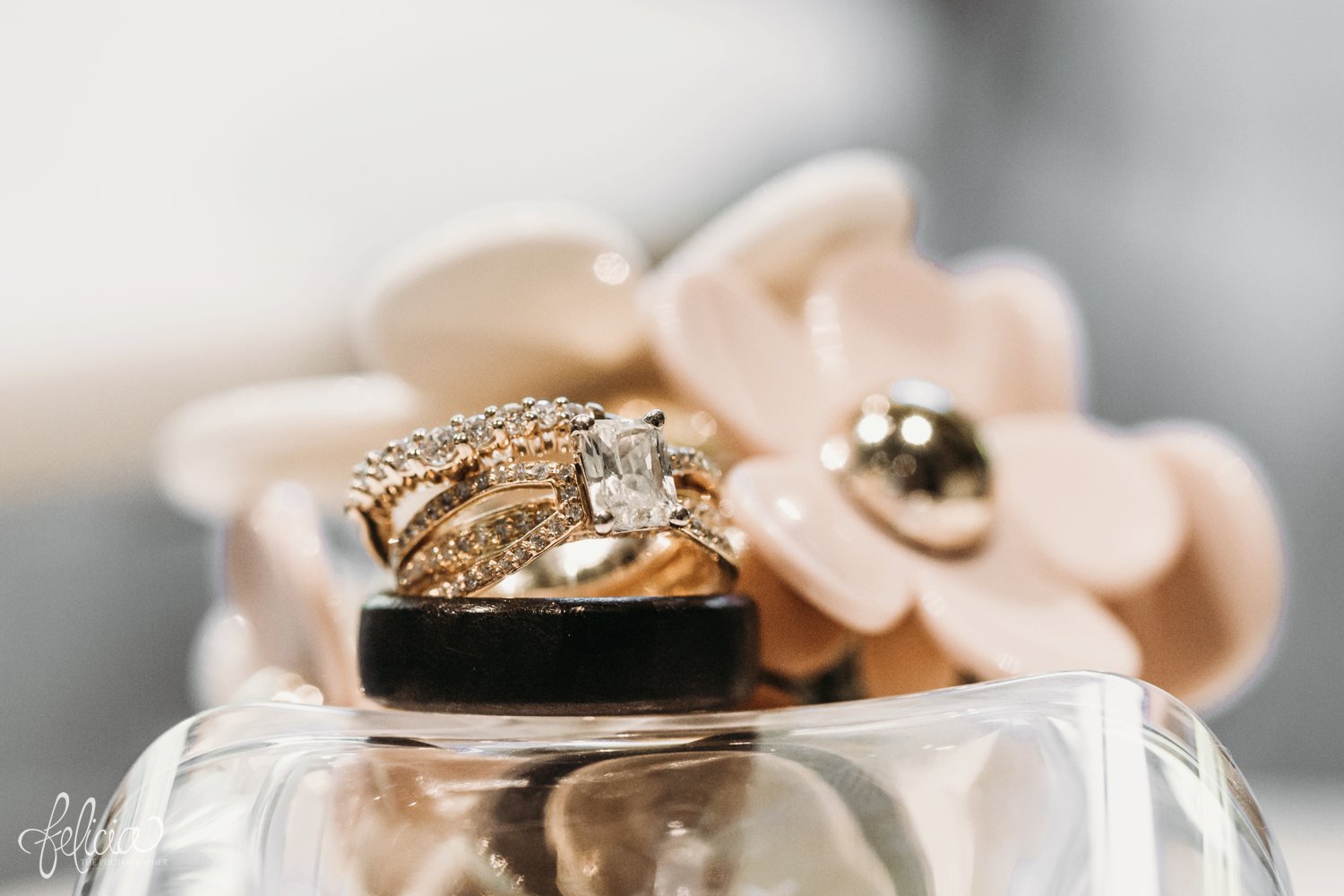 images by feliciathephotographer.com | destination wedding photographer | kansas city | pre ceremony | details | rectangle diamond engagement ring | men's black band | meierottos | glamorous | elegant | perfume | 