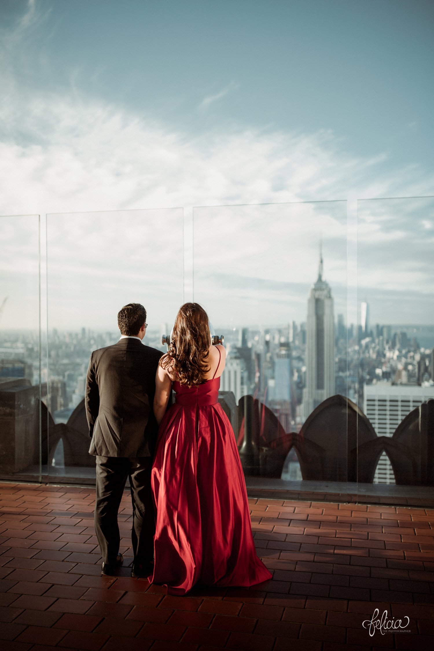 images by feliciathephotographer.com | destination wedding photographer | engagement | new york city | skyline | downtown | urban | formal | classic | elegant | long red gown | suit and tie | top of the rock | sunrise | elegant | glam | 